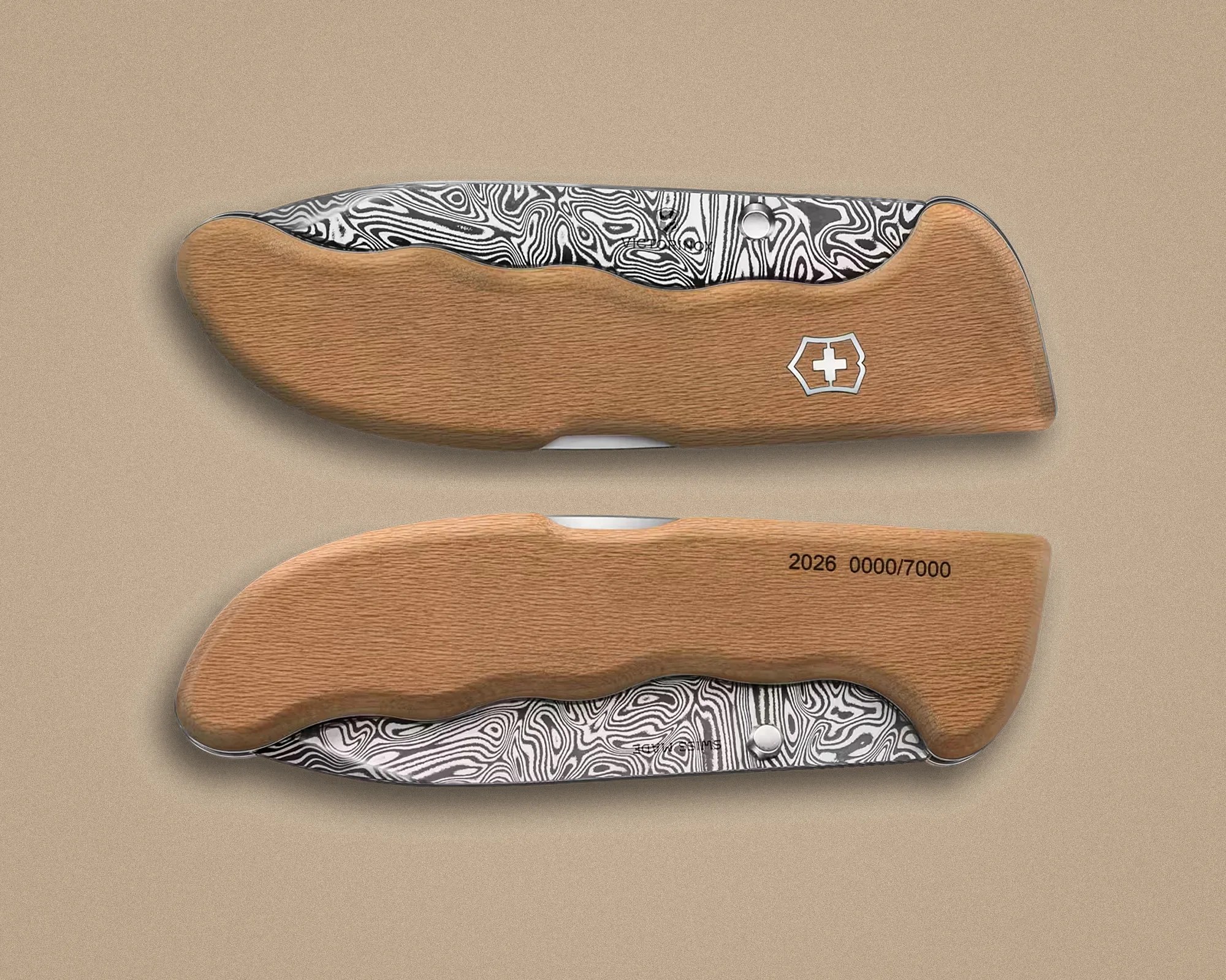 Folding knife with a patterned steel blade and a light brown wooden handle featuring a white cross emblem.