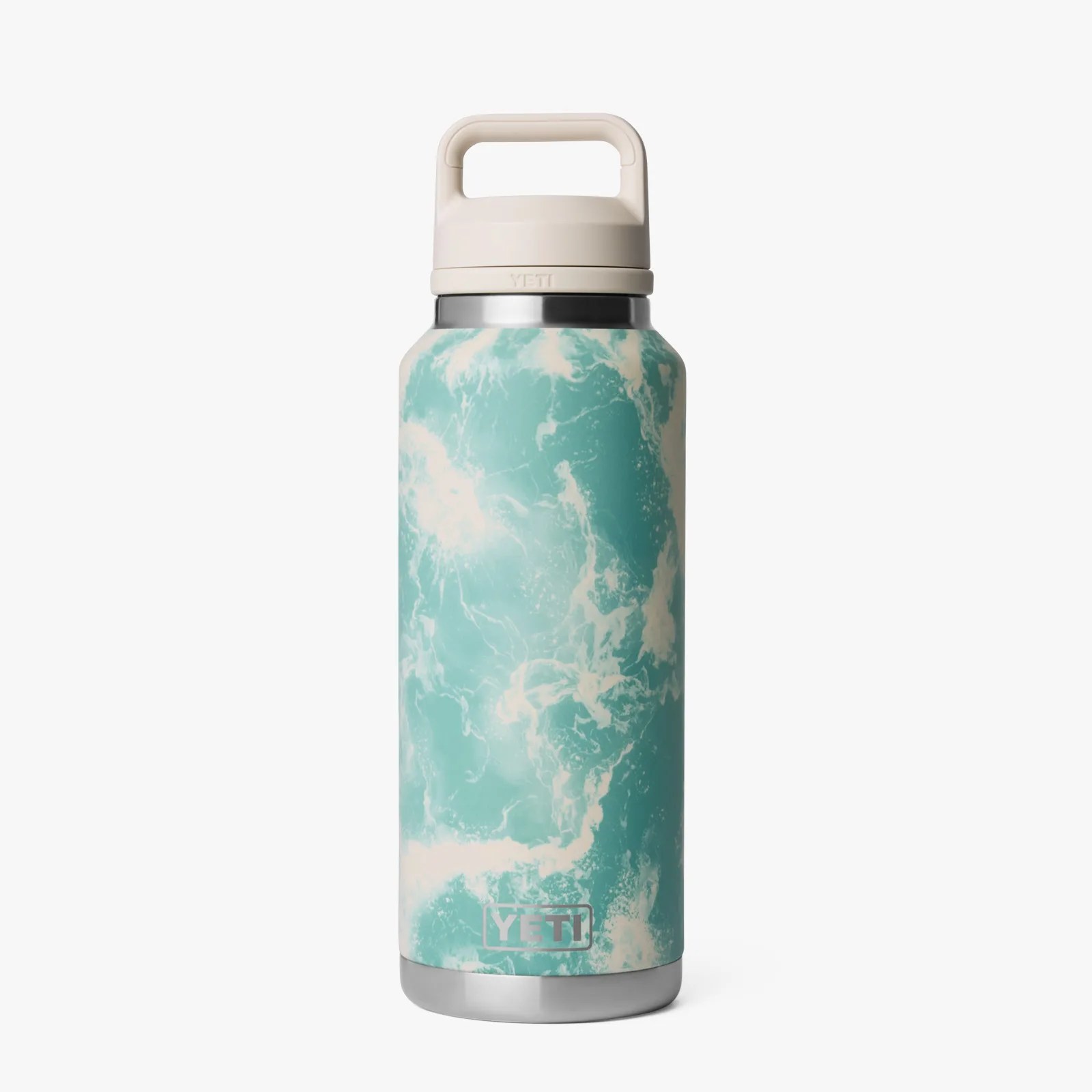 Tall YETI insulated bottle with a seafoam green and white wave pattern and a beige handle lid.