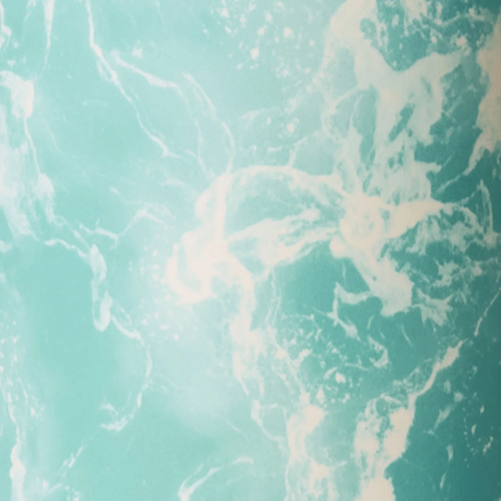Turquoise and white marble texture with swirling patterns.