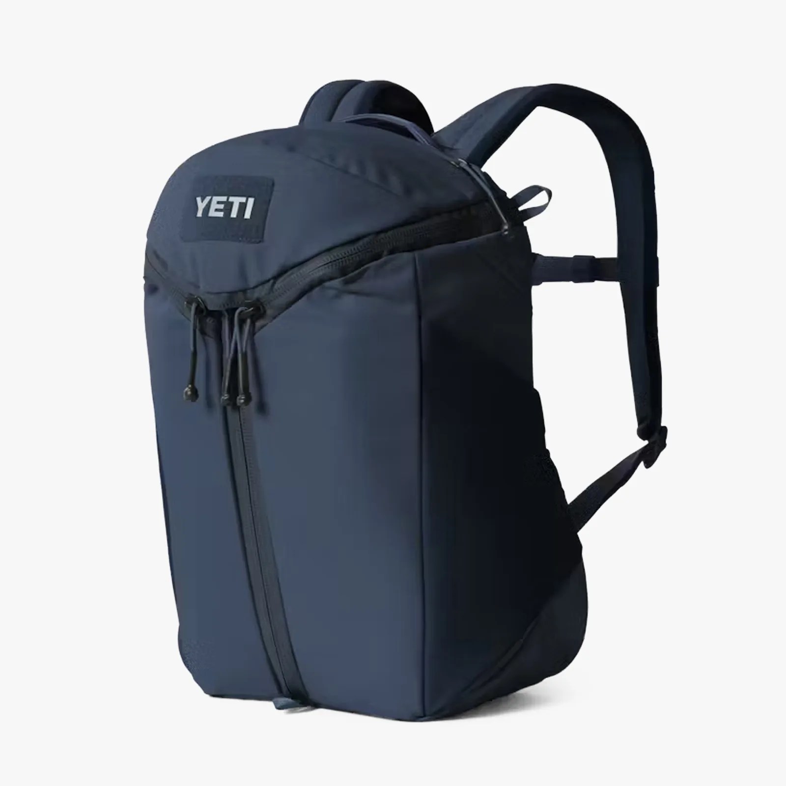 Navy blue YETI backpack with front zipper and padded shoulder straps.