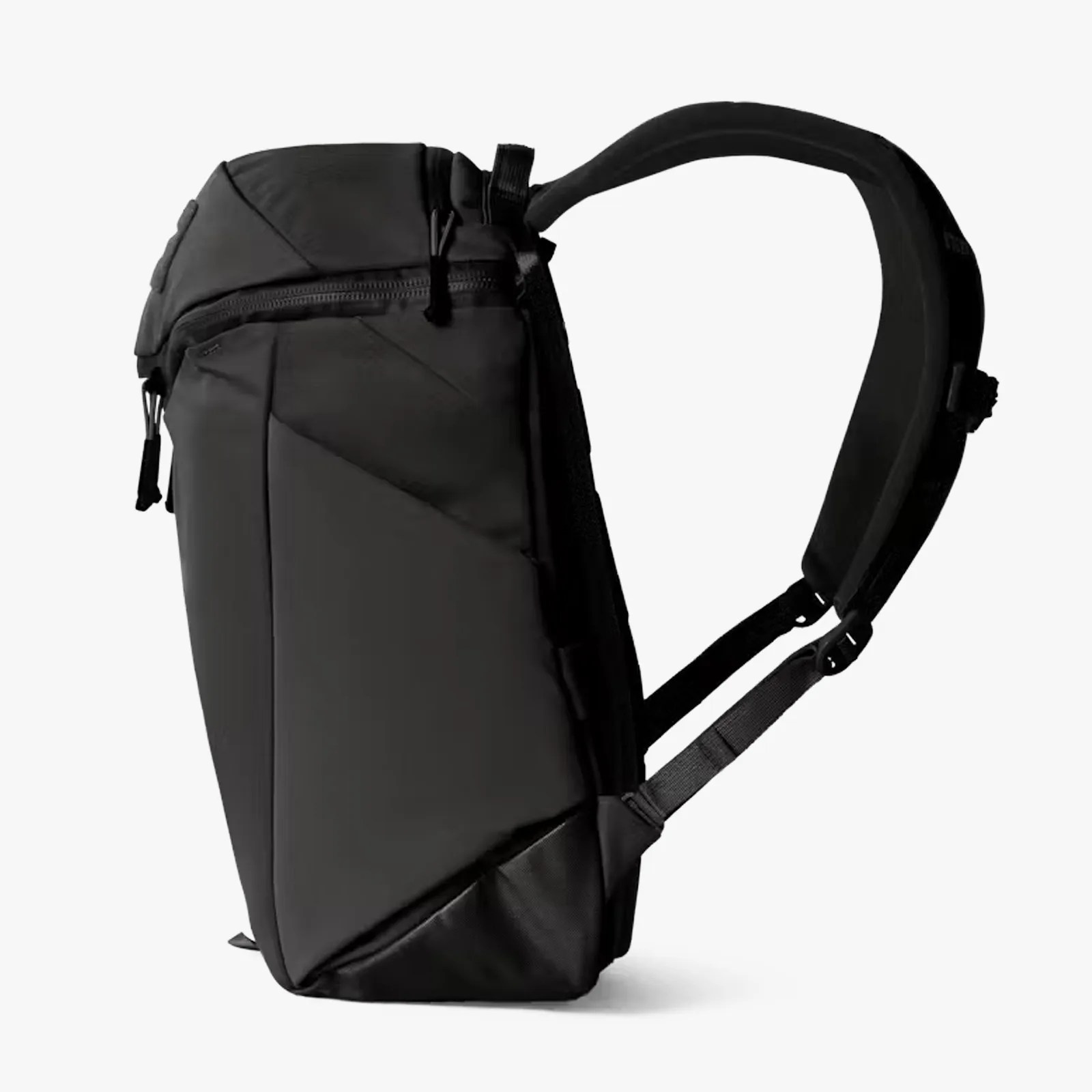 Sleek black backpack with padded shoulder straps and a zippered top compartment shown from the side.