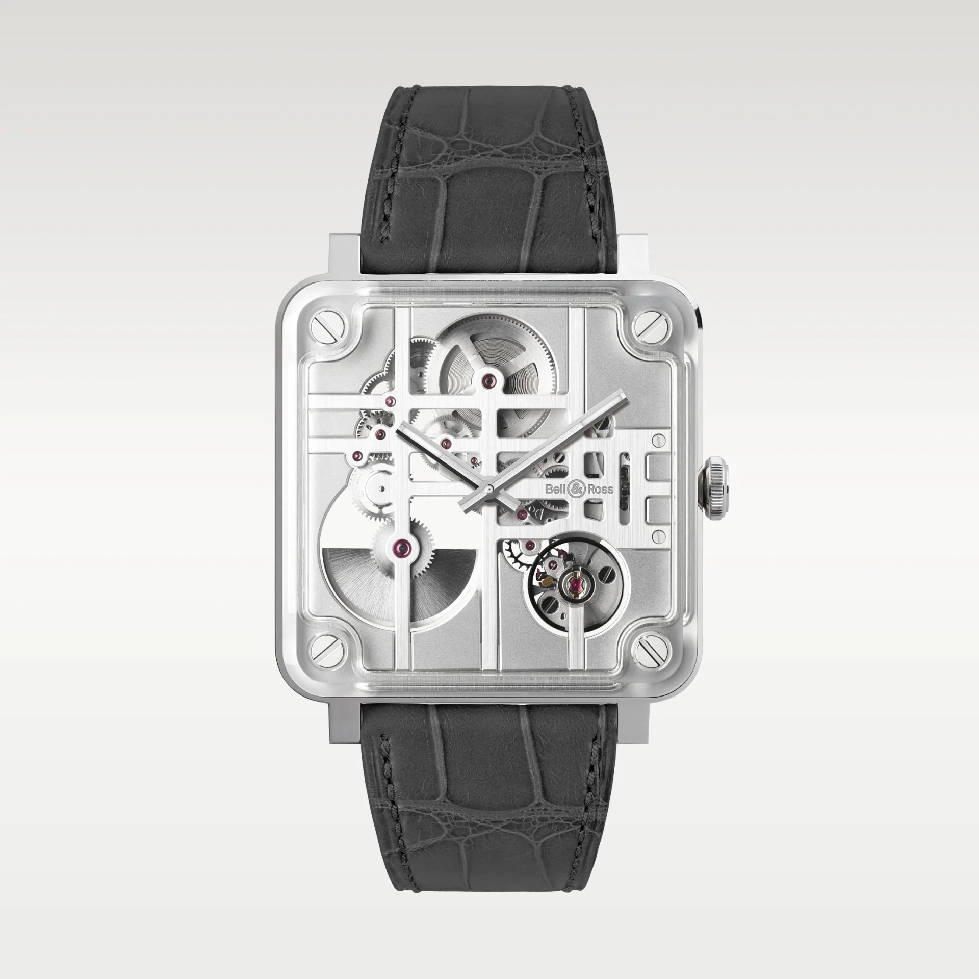 Square silver skeleton watch with visible gears and black leather strap.