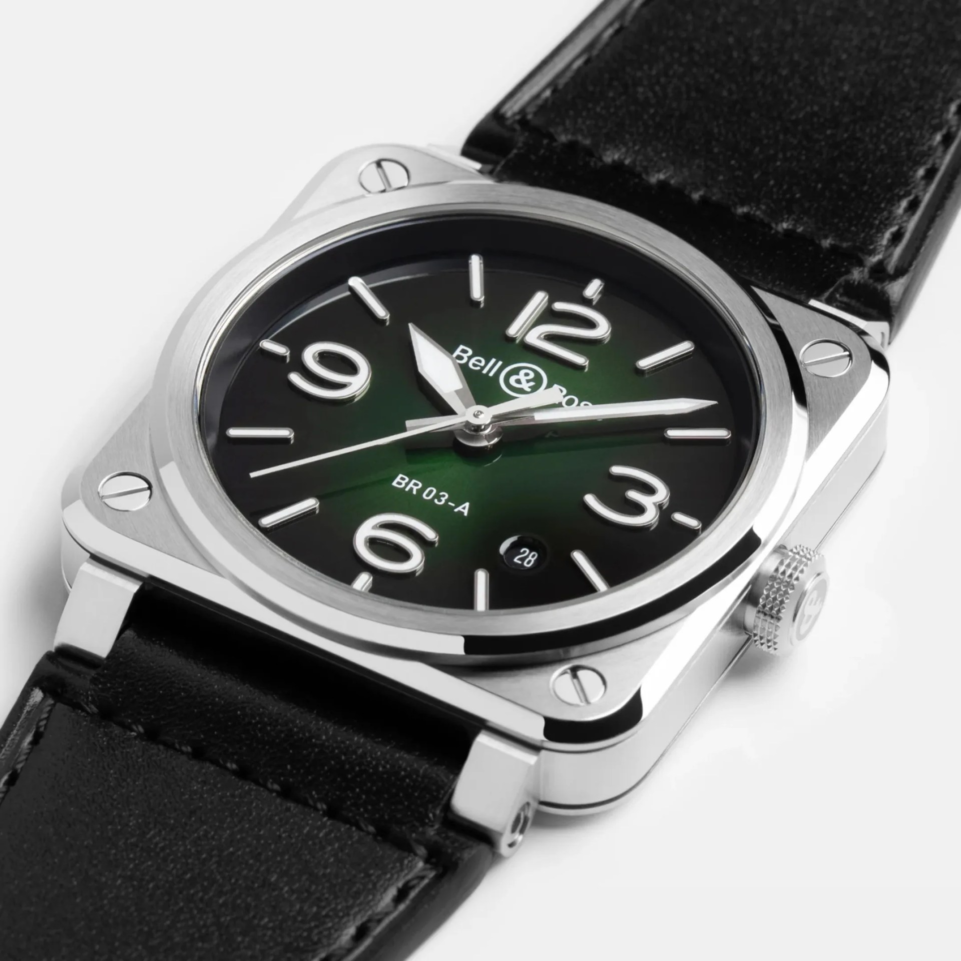 Close-up of a Bell & Ross BR-03 wristwatch with a green dial, silver numerals, and a black leather strap.