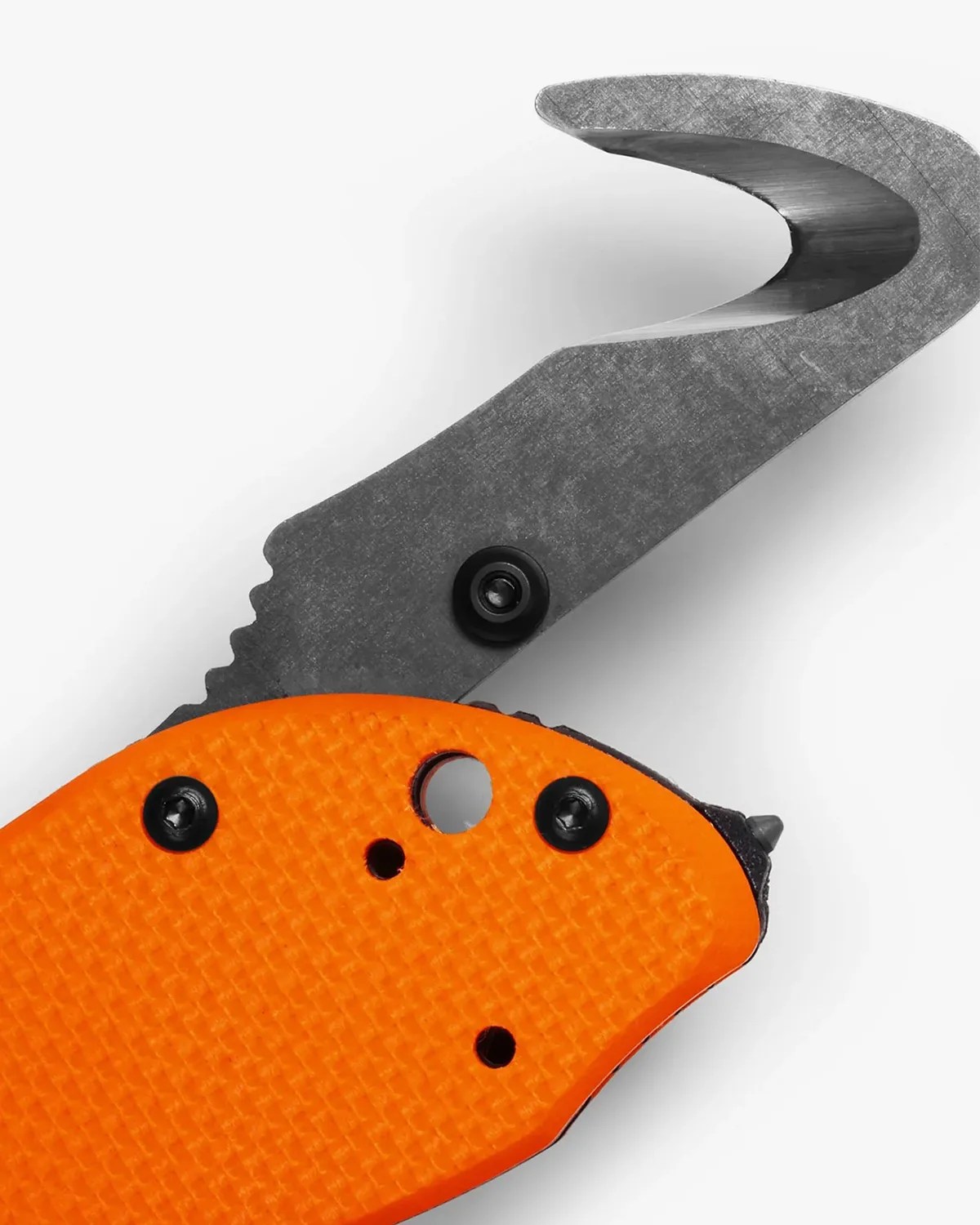 Close-up of a hook-shaped gray metal blade with an orange textured handle and black screws.