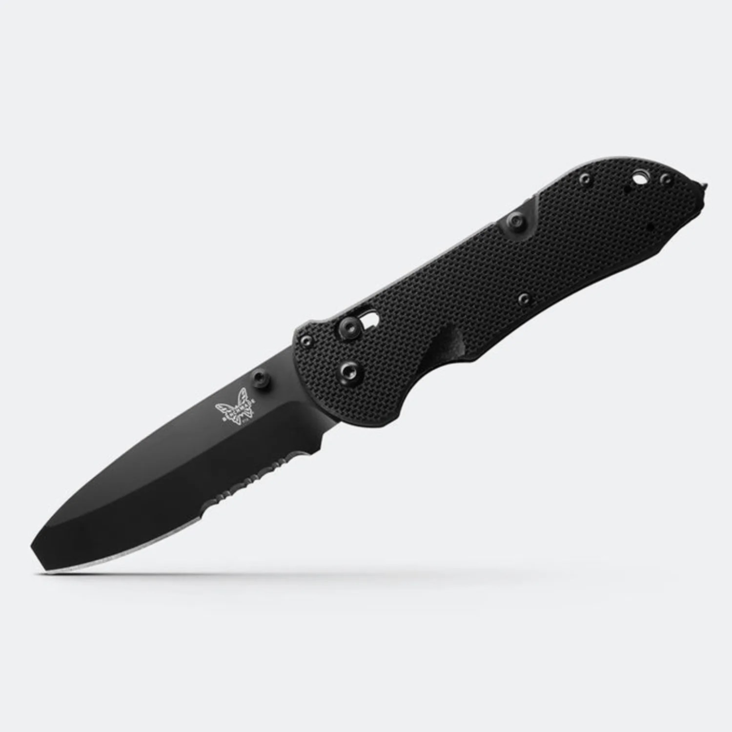 Black folding knife with partially serrated tanto blade and textured handle.