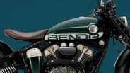 Dark green motorcycle fuel tank with "BENDA" logo and brown leather seat against a teal background.