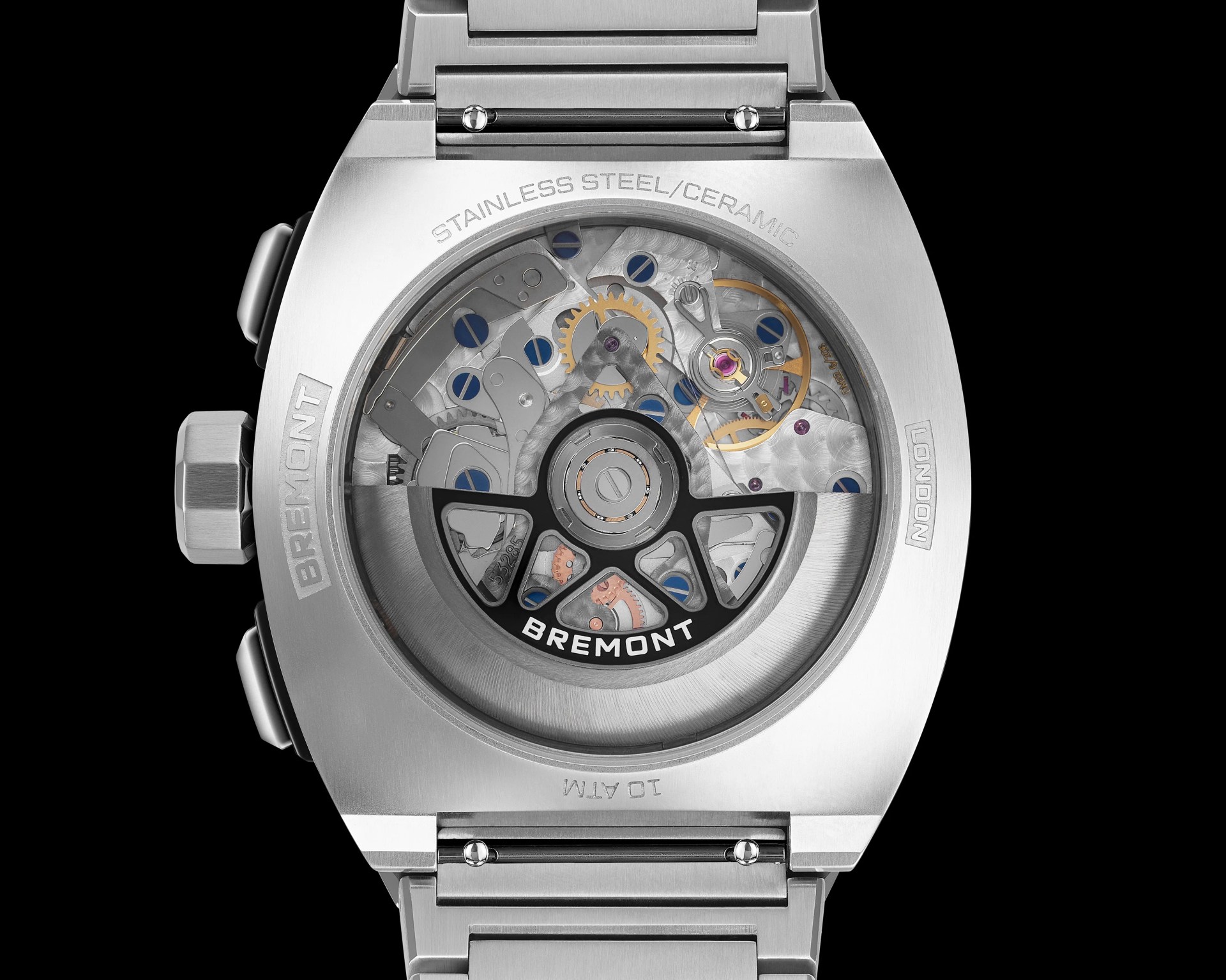 Back of a Bremont stainless steel watch showing the mechanical movement through a transparent case back.
