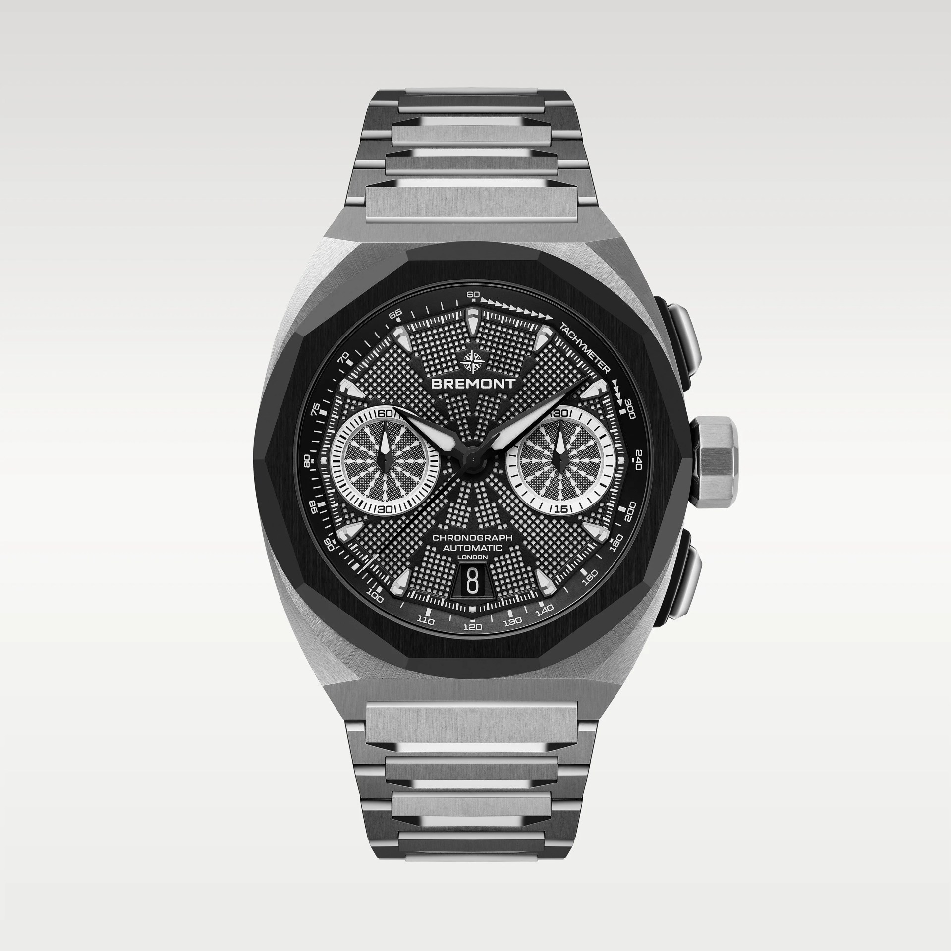 Silver stainless steel Bremont chronograph watch with black textured dial and tachymeter bezel.
