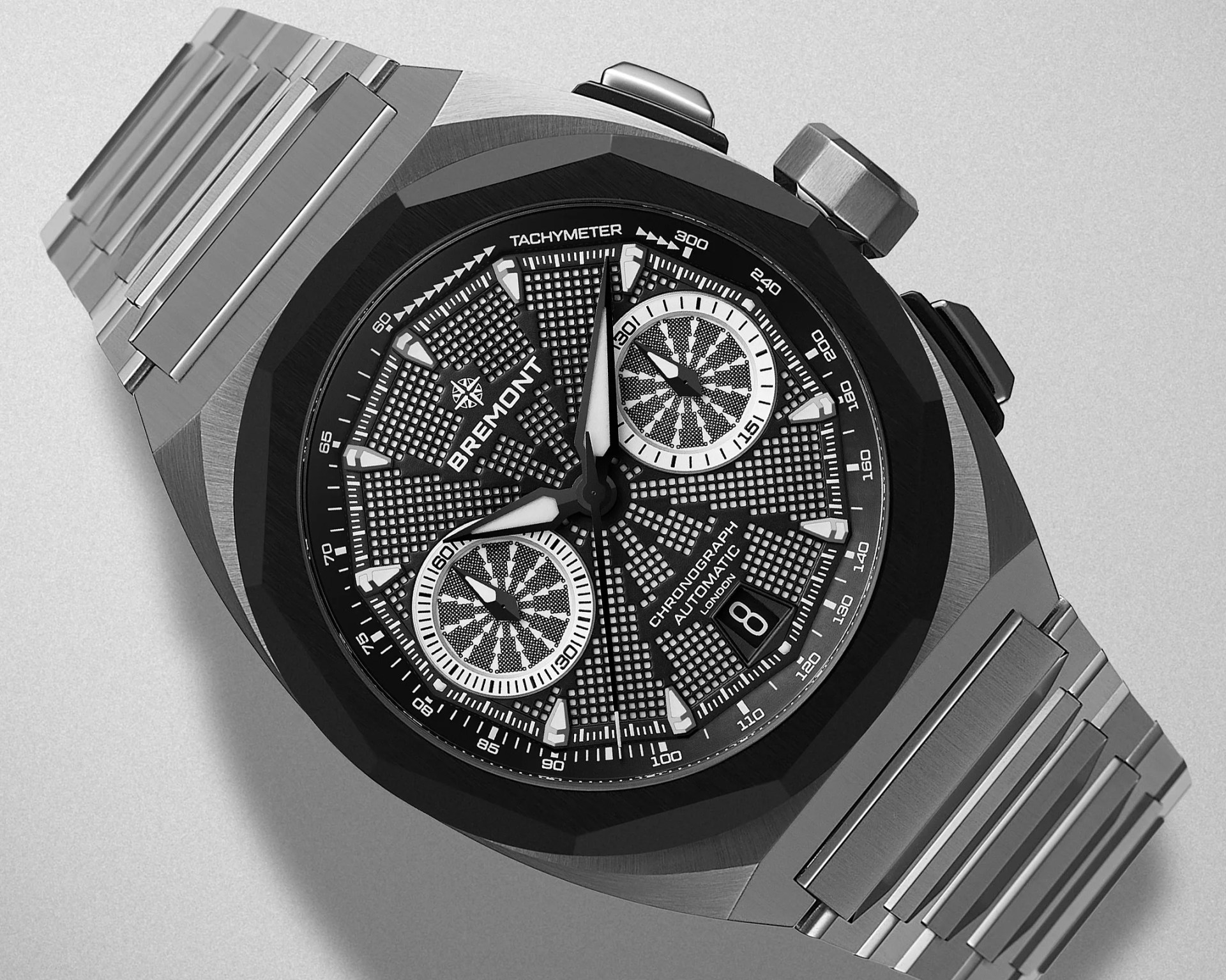 Black and silver Bremont chronograph watch with textured dial and stainless steel bracelet.
