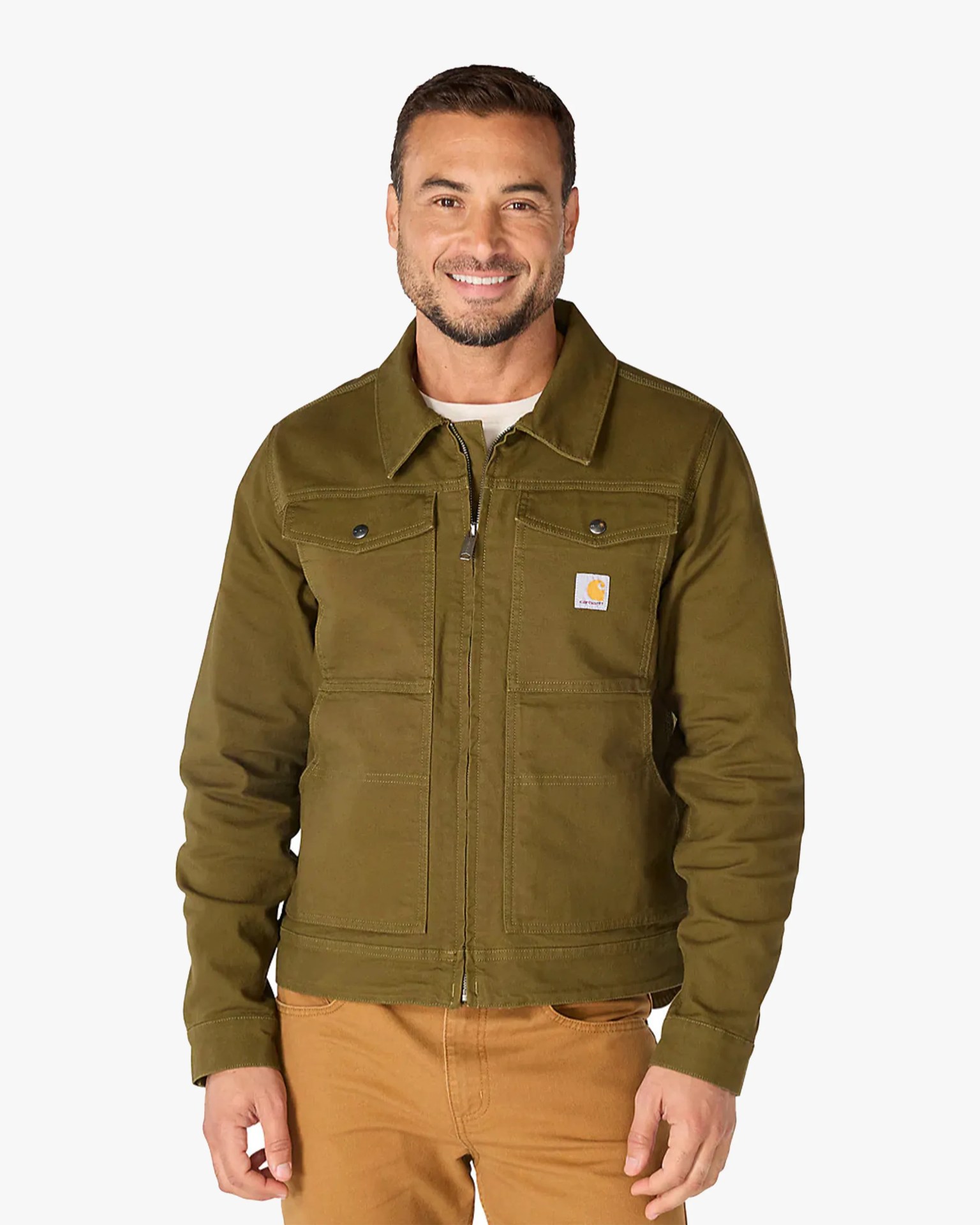 Olive green zip-up work jacket with chest pockets and Carhartt logo worn by a smiling man.