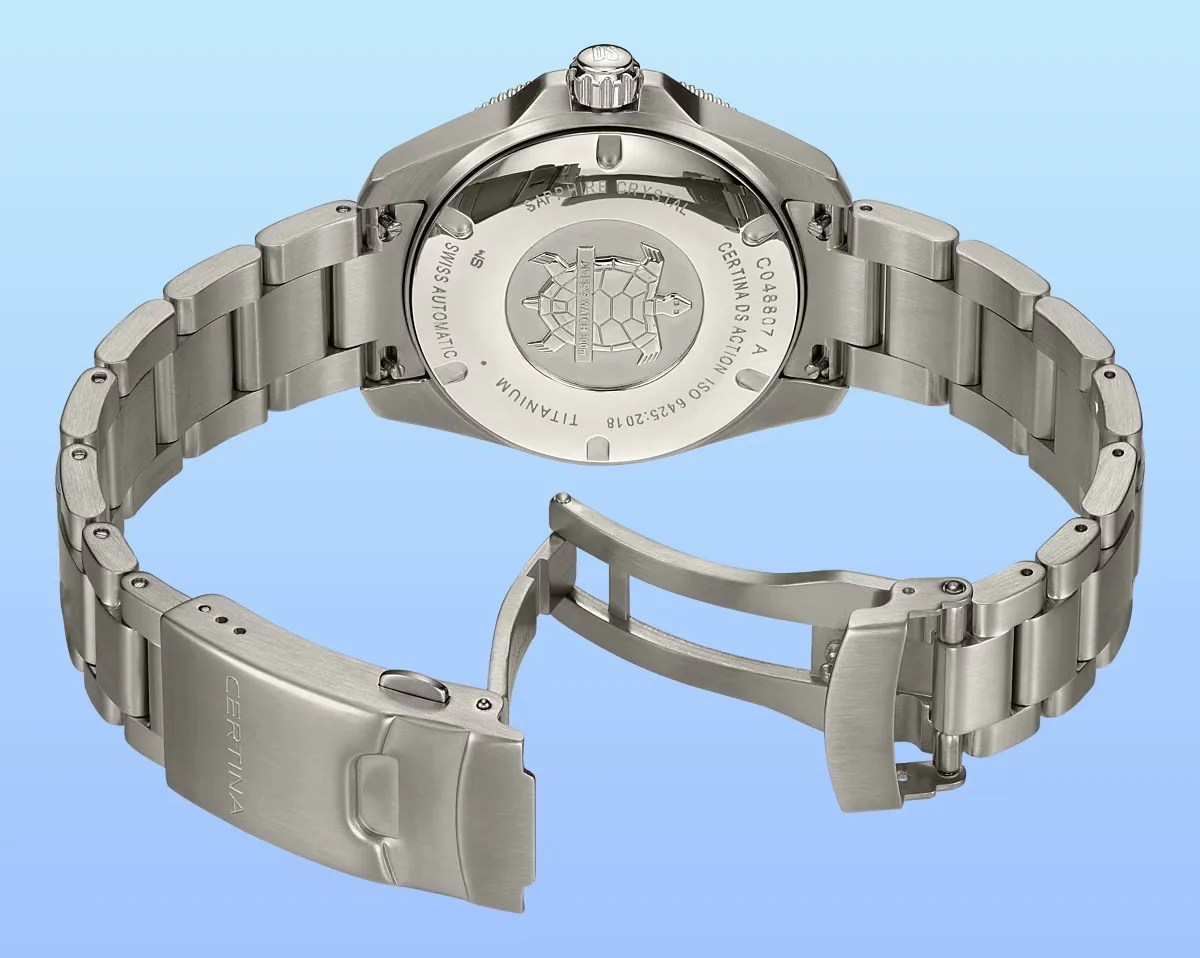 Titanium Certina DS Action watch with open stainless steel bracelet clasp and engraved turtle logo on the case back.