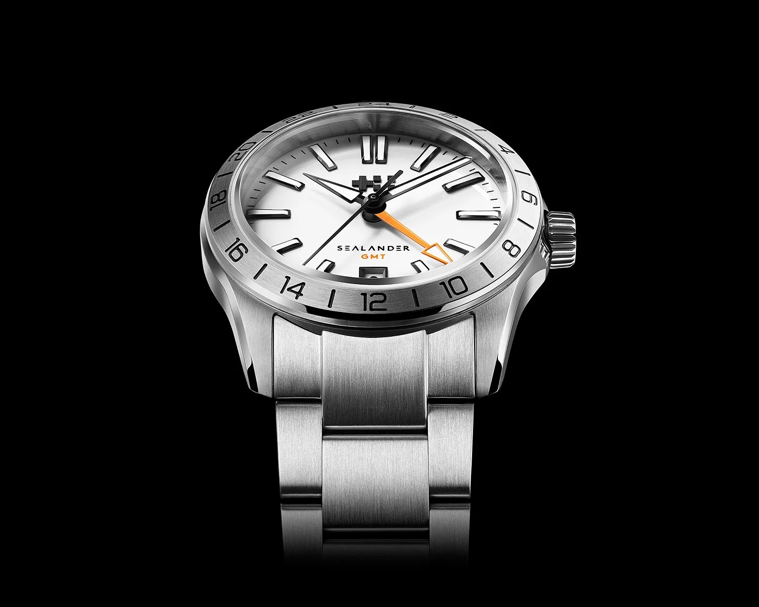 Stainless steel Sealander GMT wristwatch with white dial, black hour markers, and orange GMT hand on metal bracelet.