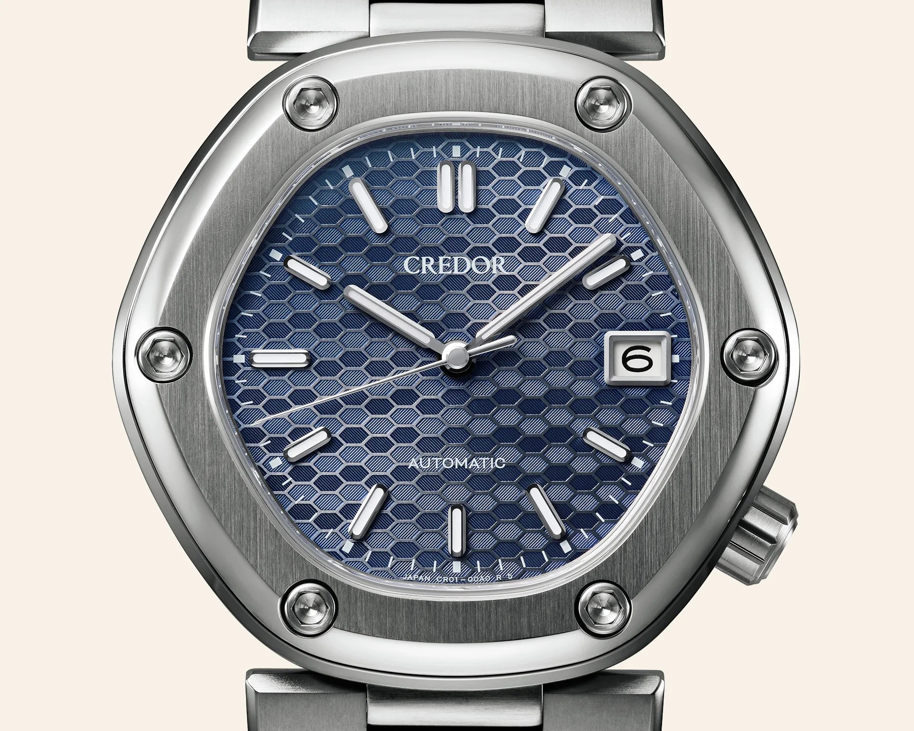 Silver stainless steel watch with a blue hexagonal patterned dial, white hour markers, and a date window at 3 o'clock.
