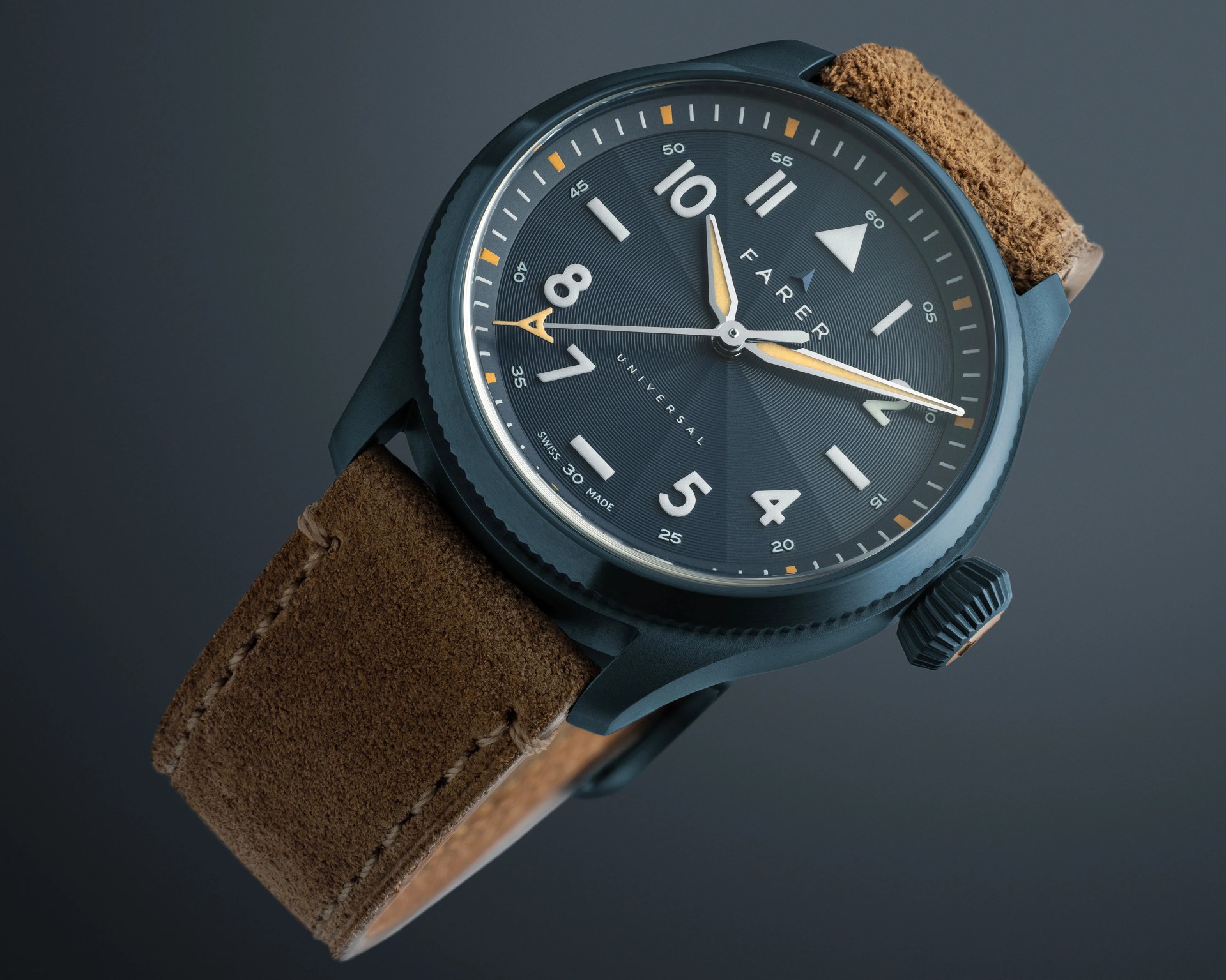 Close-up of a Farer wristwatch with a dark blue dial, yellow and white hands, and a brown suede strap.