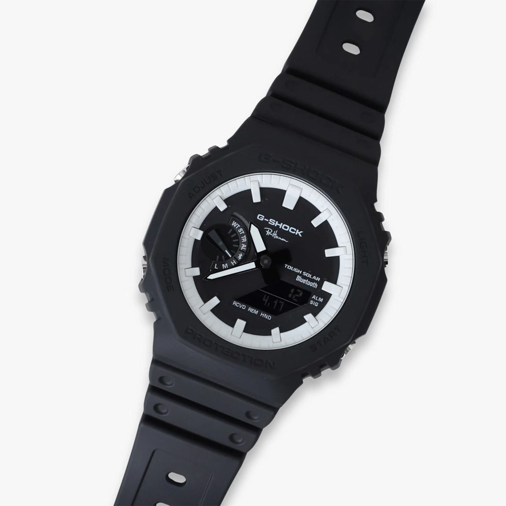 Black G-Shock watch with white hour markers, digital display, and black resin strap.