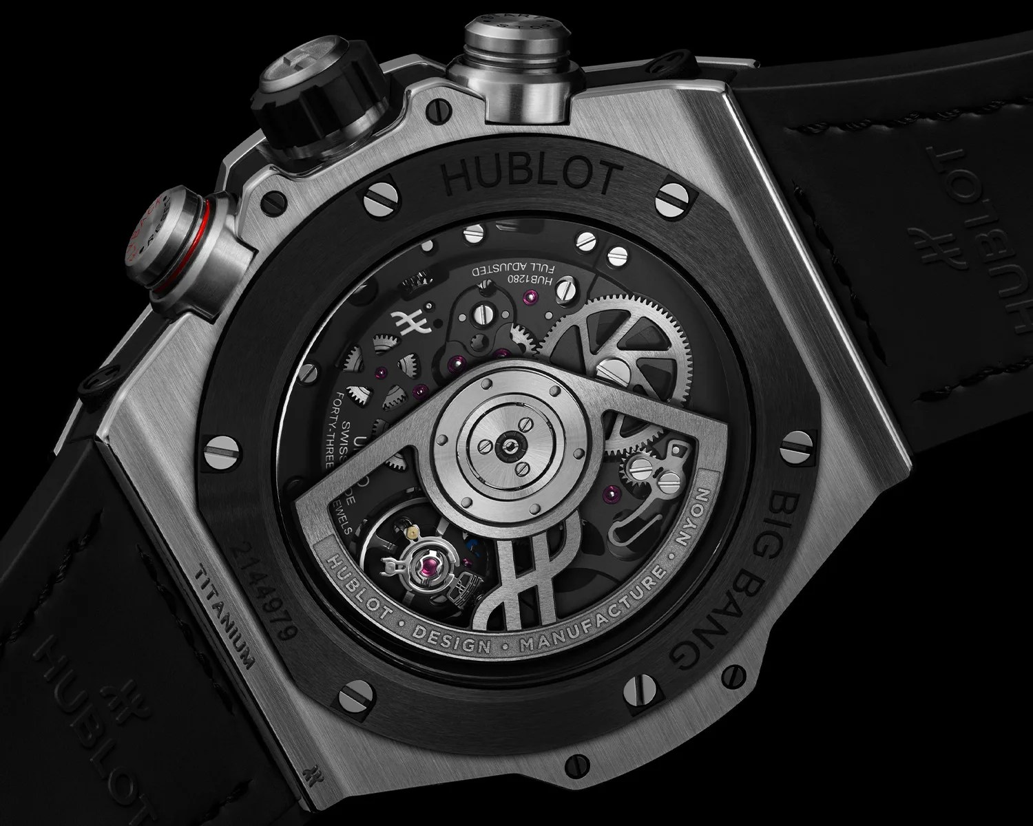 Close-up of the back of a Hublot Big Bang titanium watch showing the intricate mechanical movement and black leather strap.