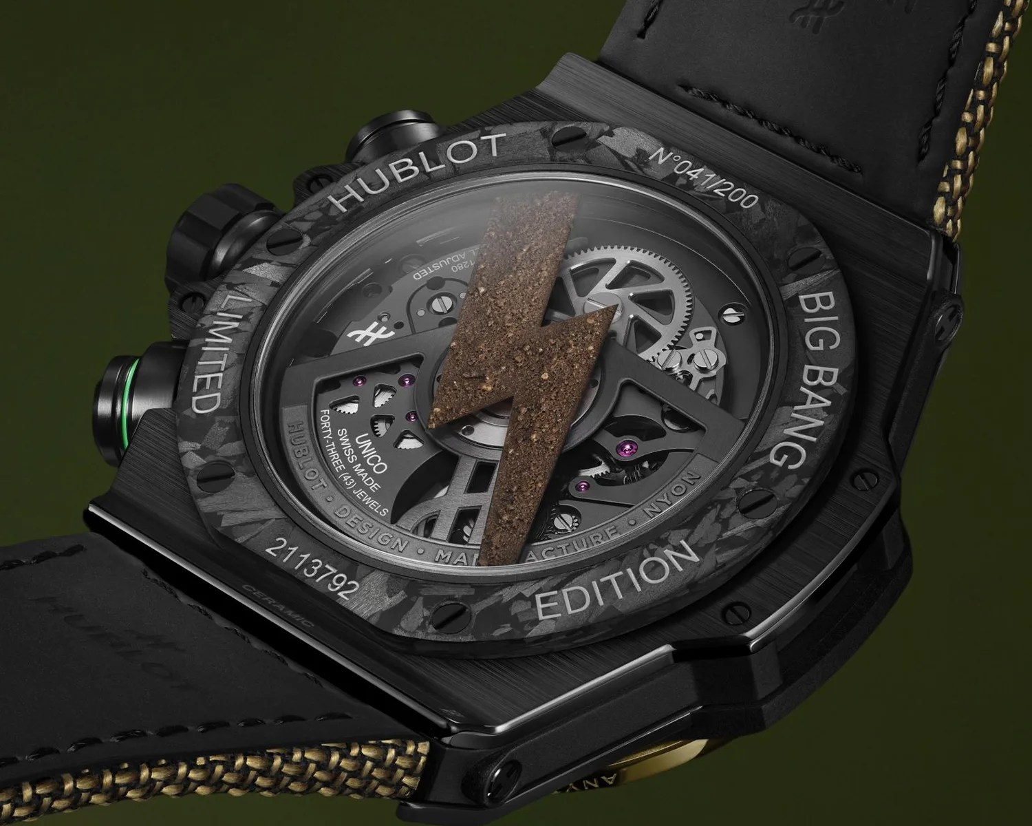 Back of a limited edition Hublot Big Bang watch with visible gears and a brown lightning bolt detail.