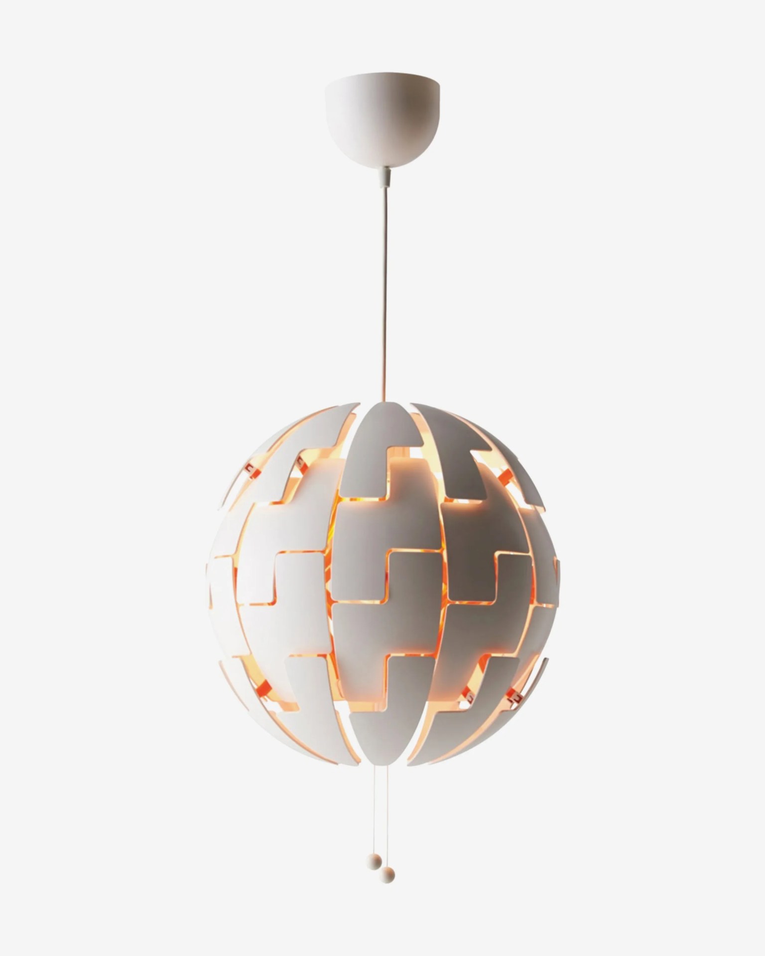 White spherical pendant lamp with interlocking curved panels and warm light glowing from inside.