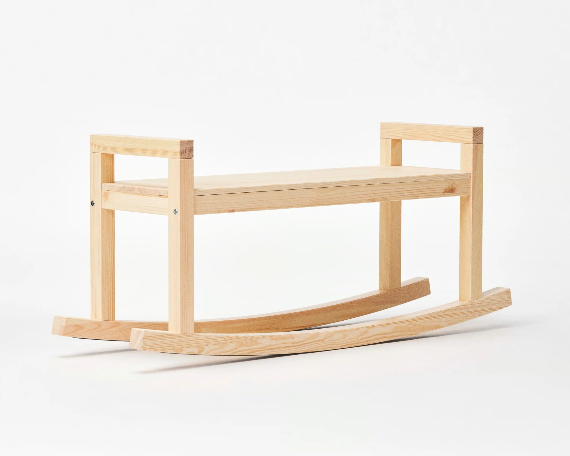 Light natural wood rocking bench with simple rectangular frame and flat seat on curved rockers.