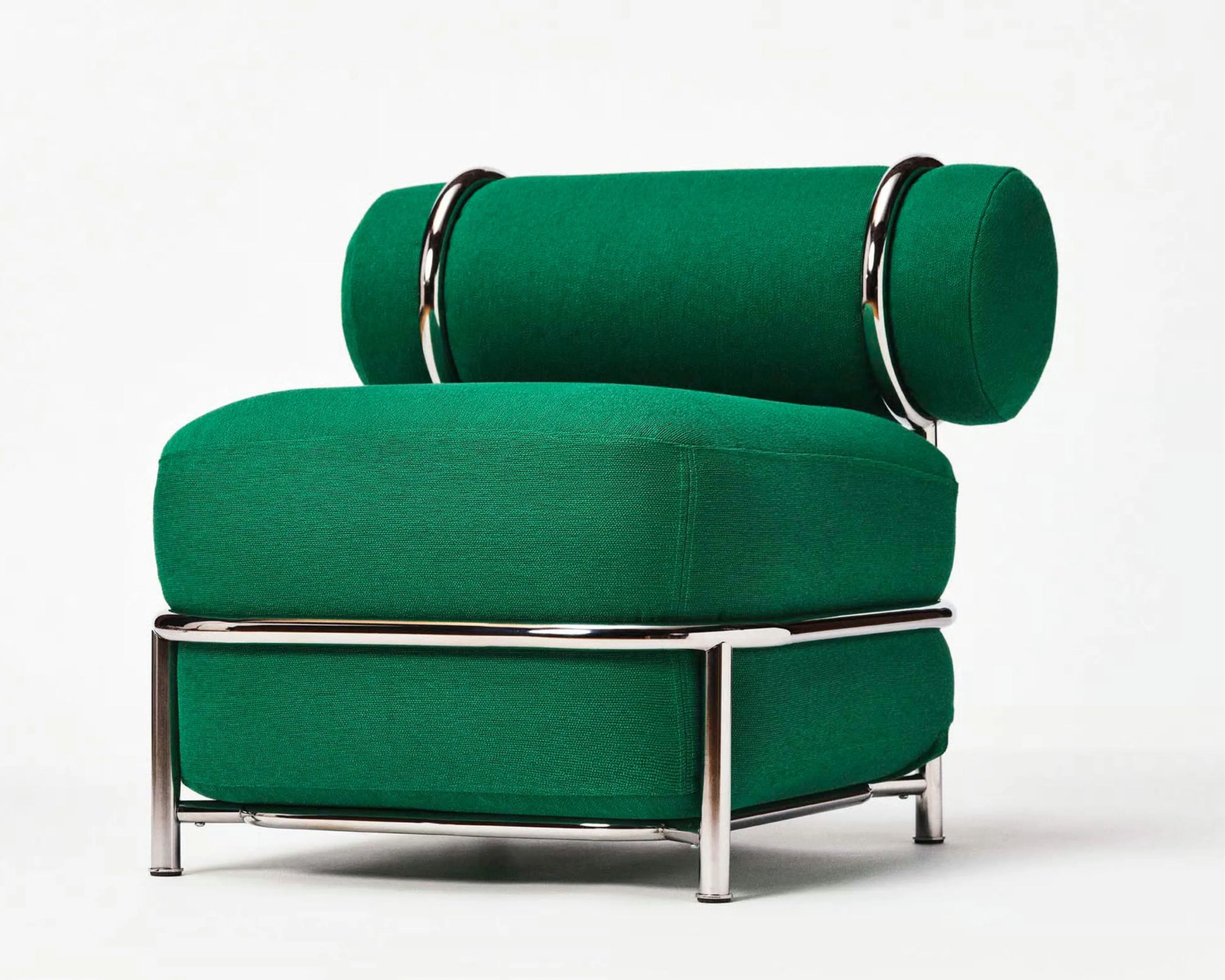 Green upholstered chair with cylindrical backrest and chrome metal frame on a white background.
