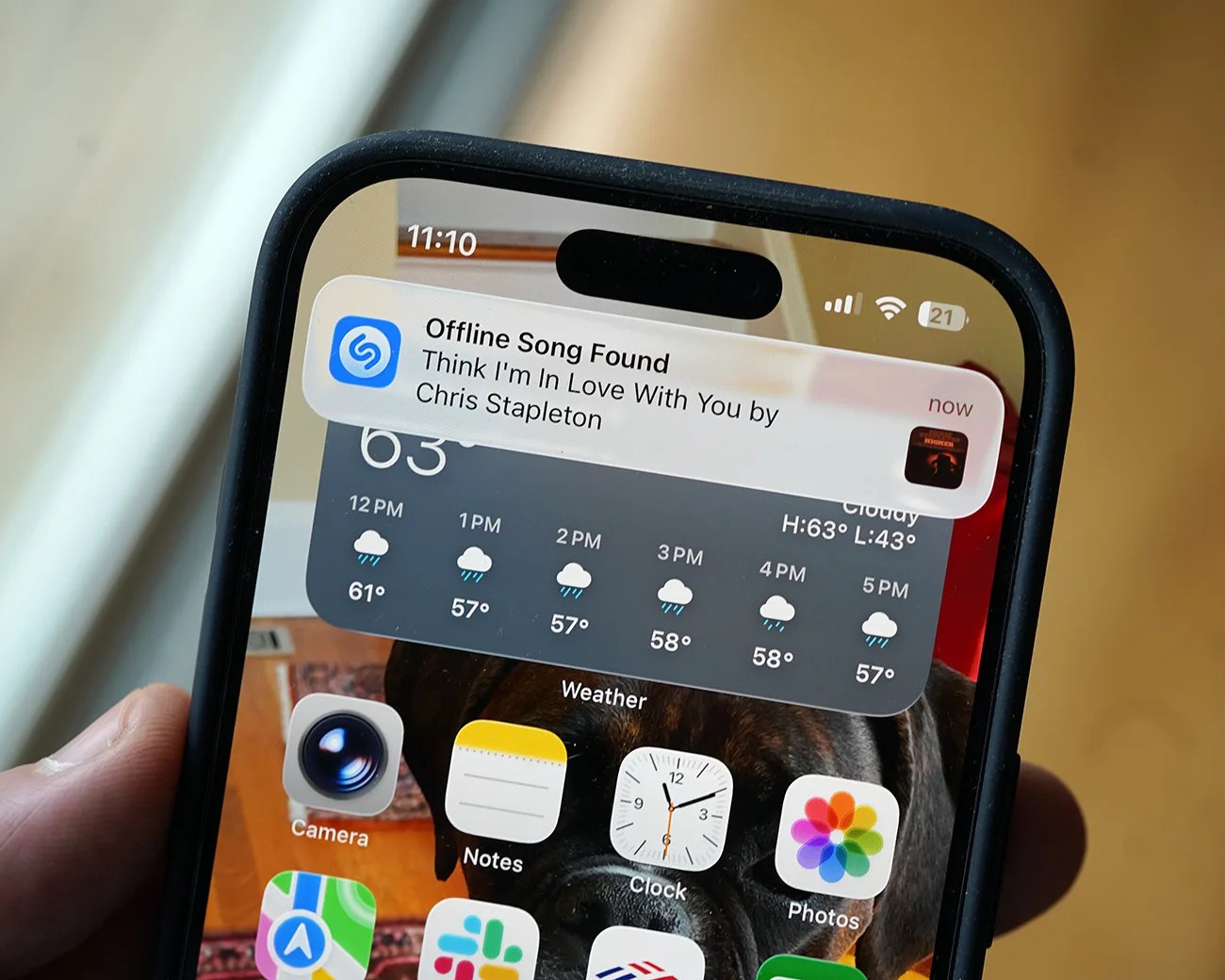 Smartphone screen showing a Shazam notification for "Think I'm In Love With You" by Chris Stapleton with weather and app icons visible.