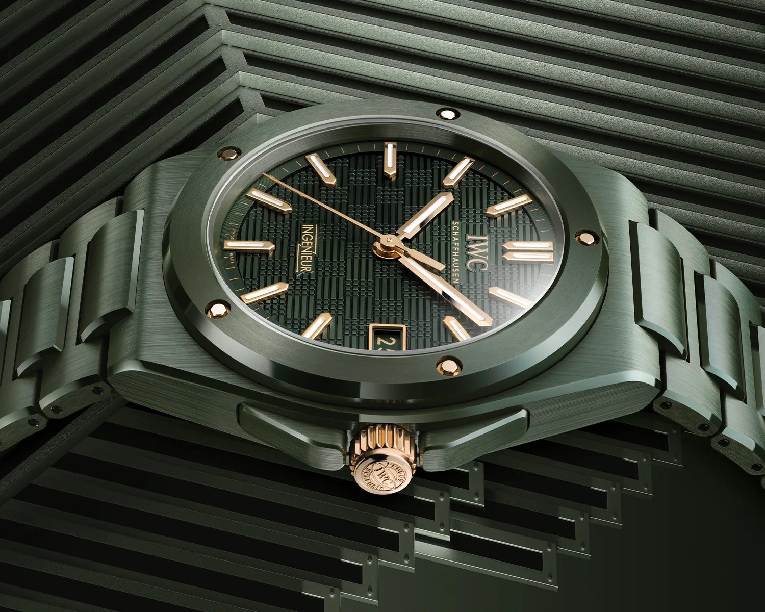 Green wristwatch with gold accents and a textured dial on a matching geometric green background.