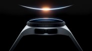 Side view of a sleek black and gray smartwatch with a glowing curved light above it on a black background.