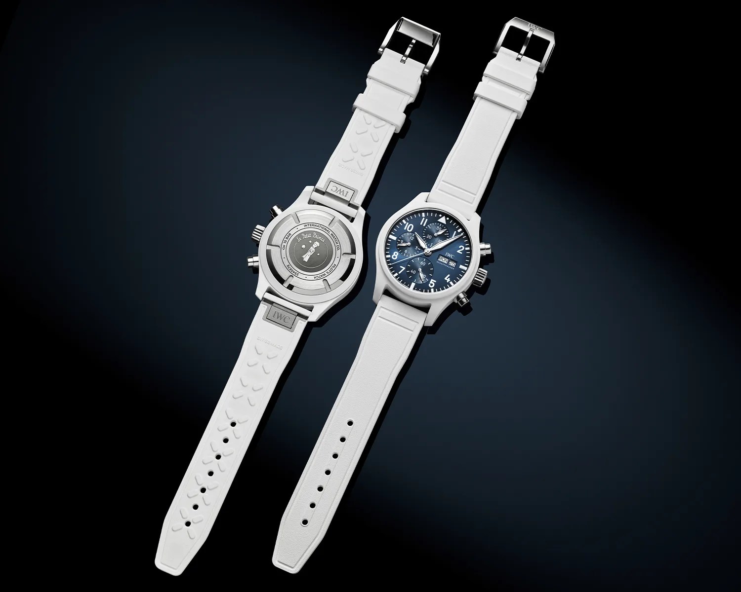 Two white wristwatches with blue dials and white straps, one showing the front and the other the back.