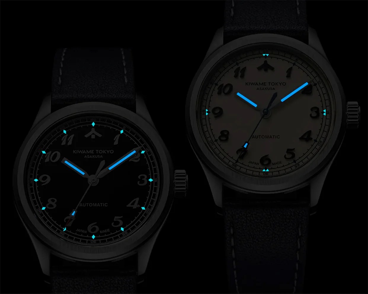 Two Kiwame Tokyo Asakusa automatic watches with black leather straps, one with a black dial and the other with a white dial, both showing blue luminescent hands and markers.