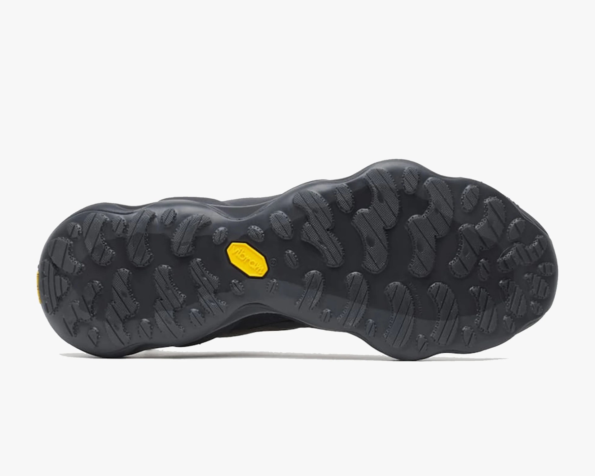 Black rubber shoe sole with textured tread pattern and yellow Vibram logo in the center.