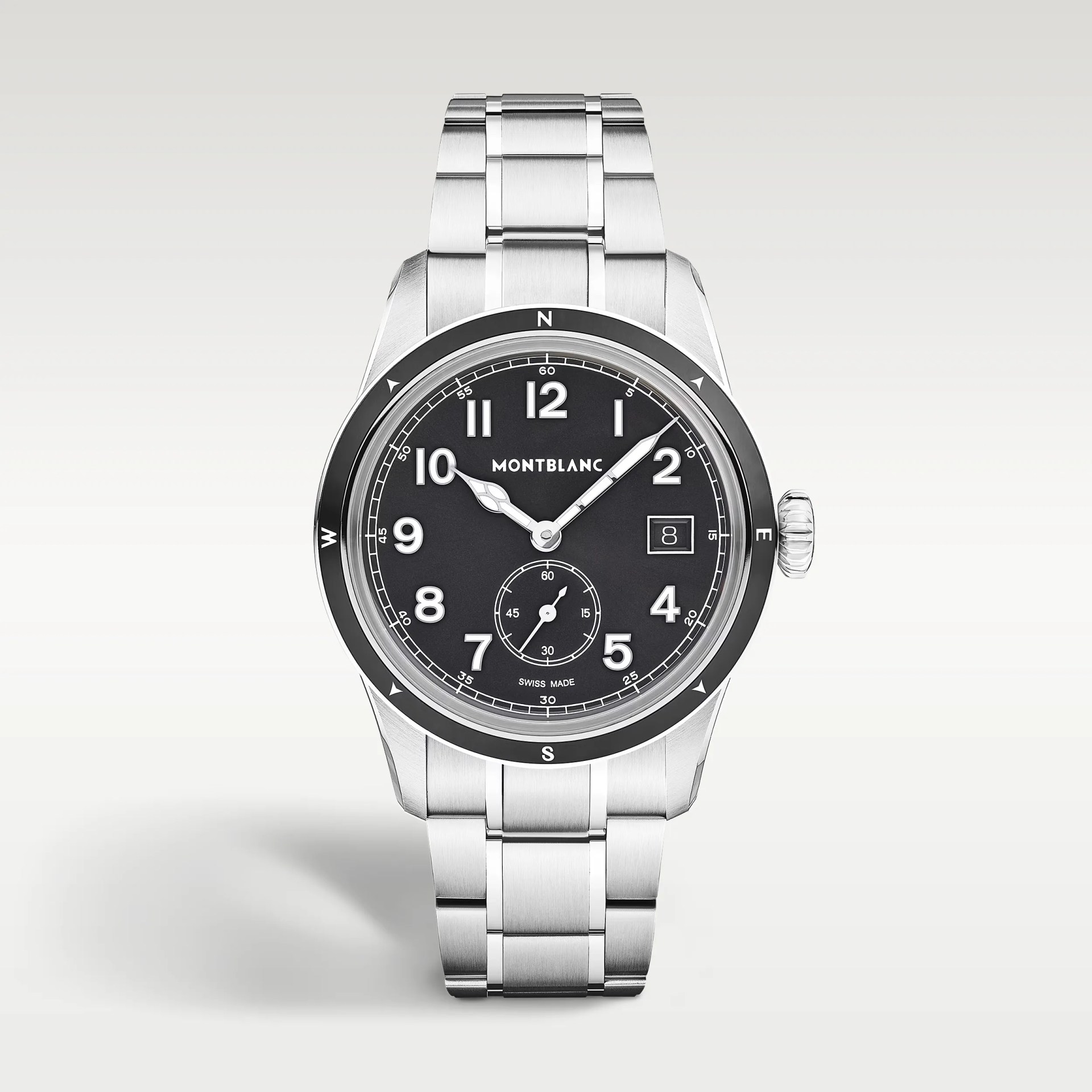 Silver Montblanc wristwatch with black dial, white numerals, date window, and stainless steel bracelet.