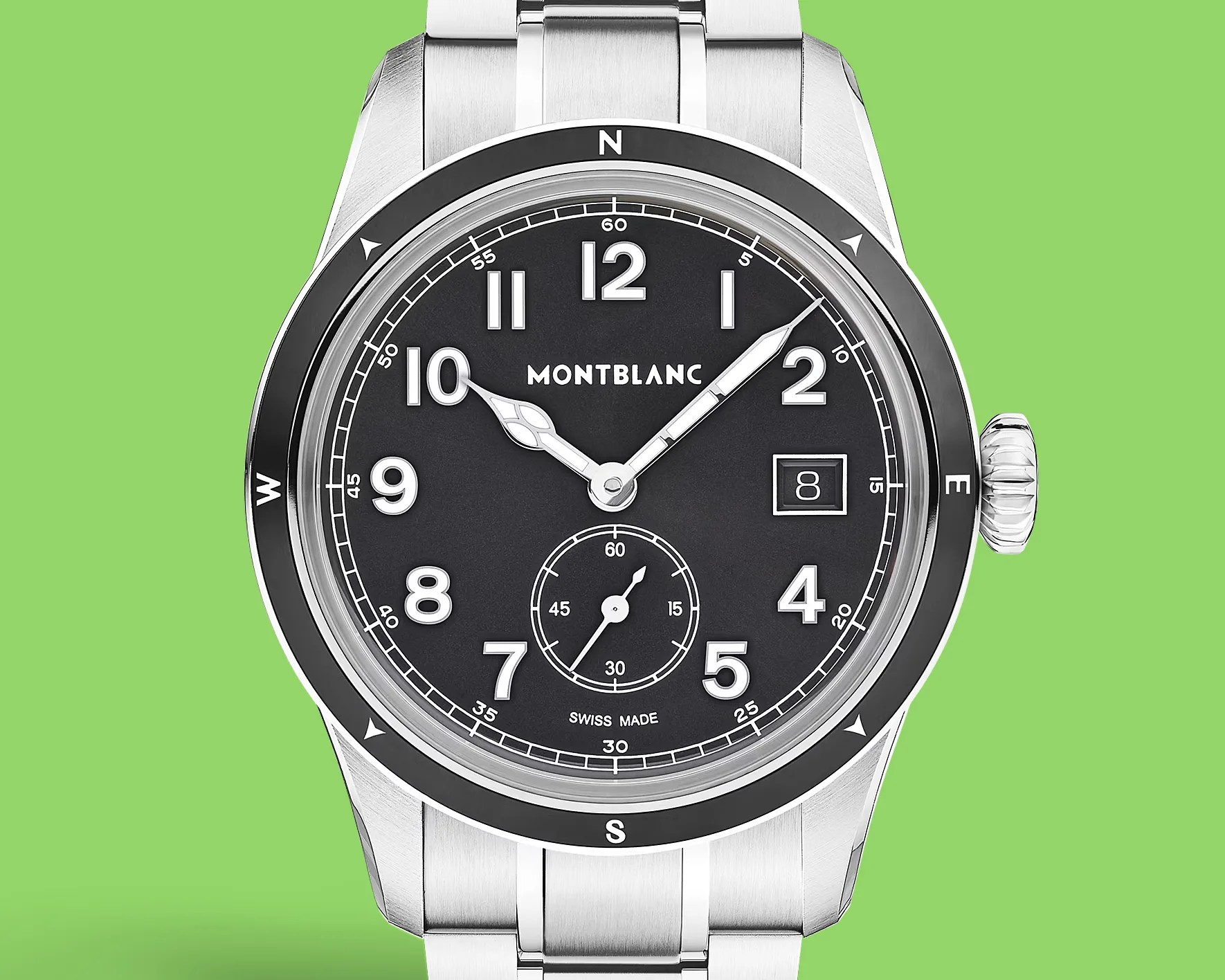 Montblanc stainless steel wristwatch with black dial, white numerals, date window, and compass bezel on a metal bracelet.