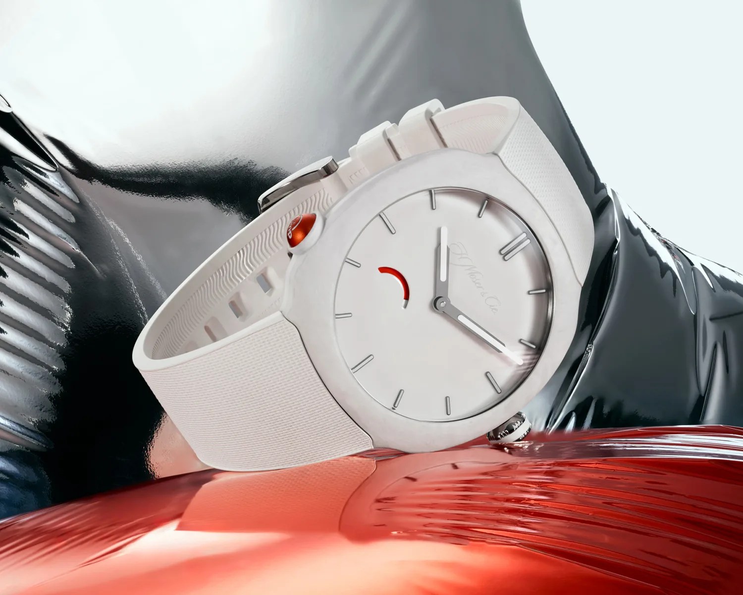 White wristwatch with a minimalist dial, red accent on the crown, and white textured strap on a reflective surface.