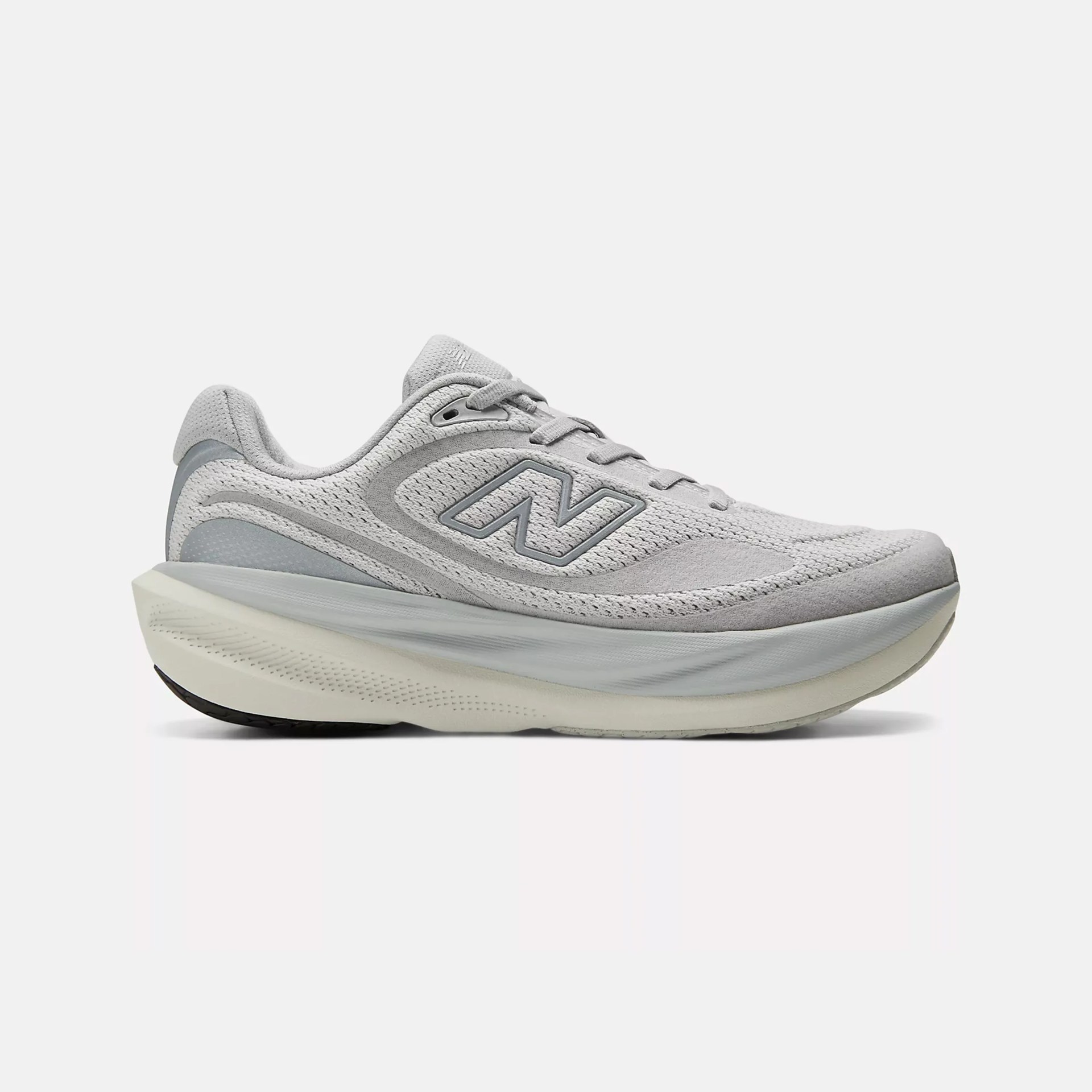 Light gray New Balance running shoe with mesh upper and thick cushioned sole.