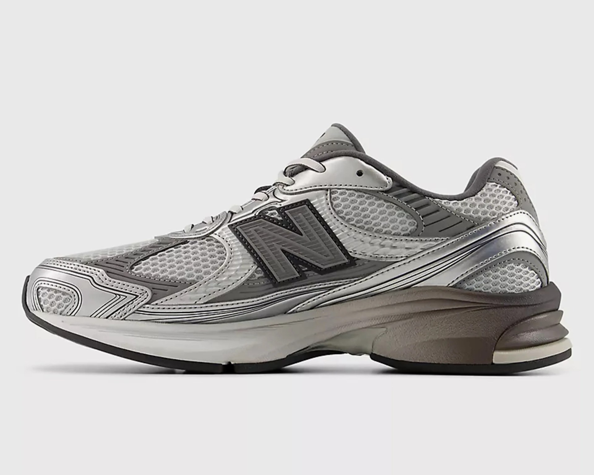 Silver and gray New Balance running shoe with mesh upper and cushioned sole.