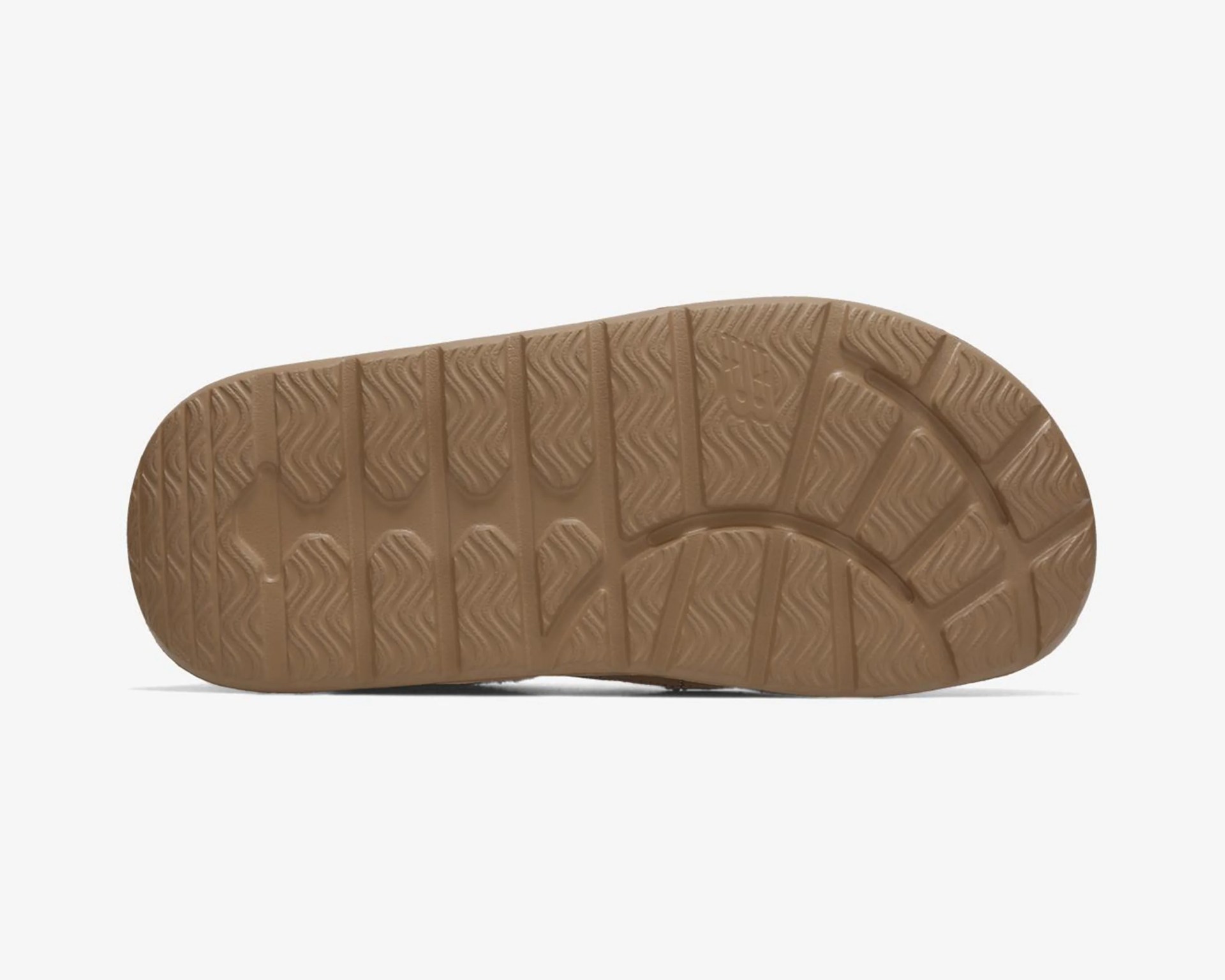 Brown rubber shoe sole with textured grip pattern and a small embossed logo.