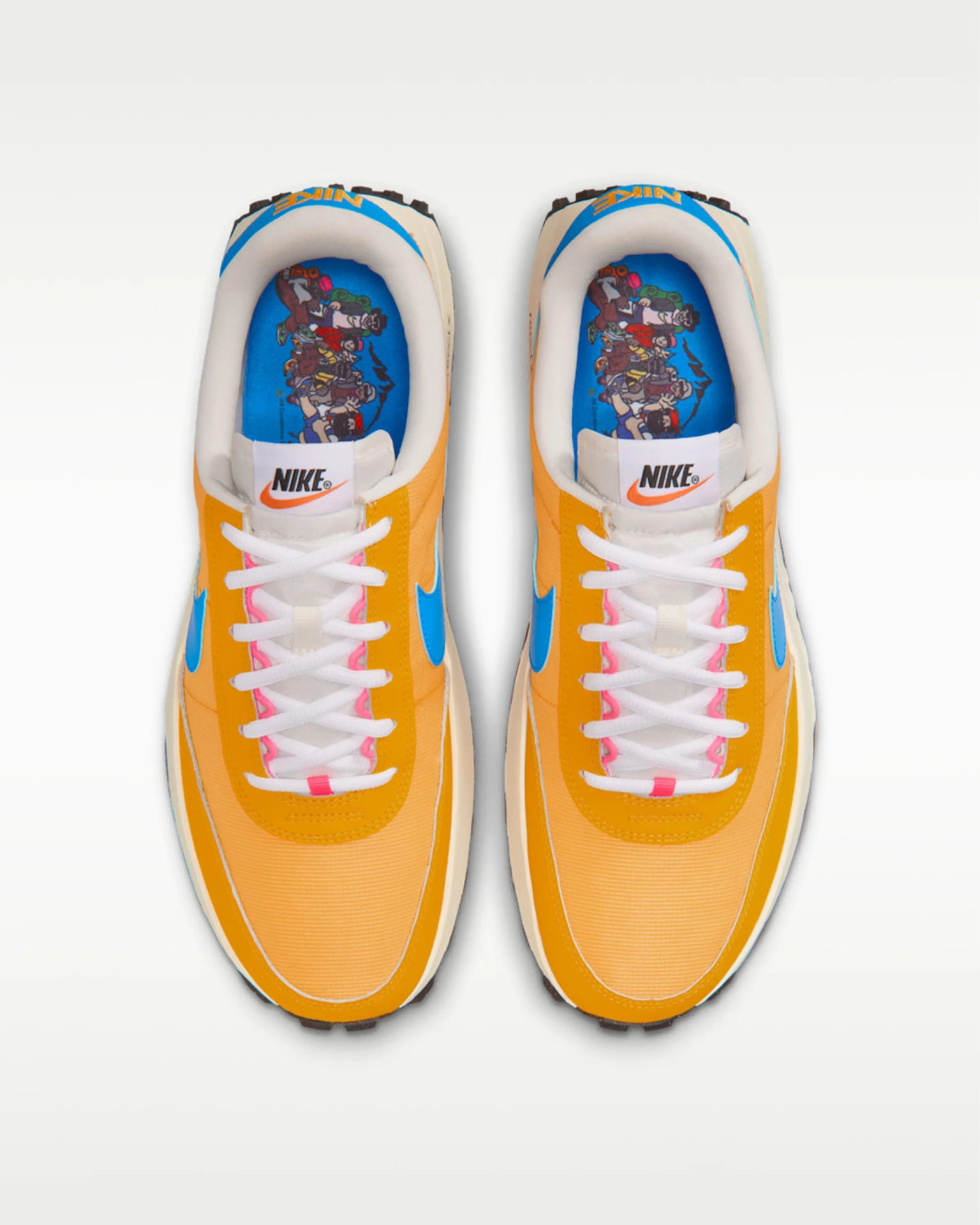 Pair of orange Nike sneakers with blue swoosh logos and cartoon character insoles, viewed from above.