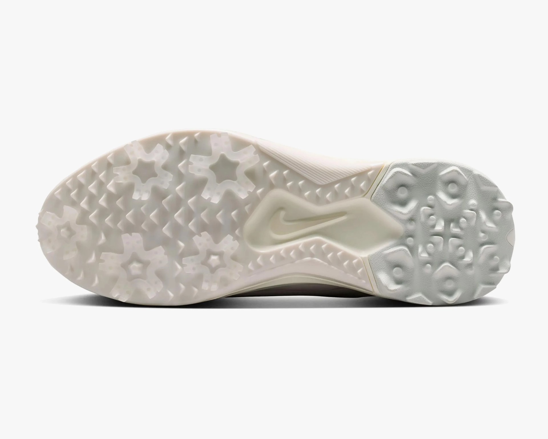 Off-white Nike shoe sole with star-shaped and geometric traction patterns.