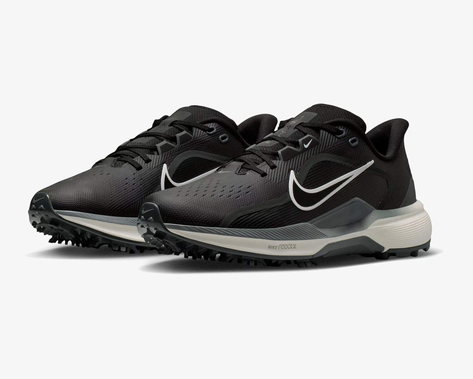 Pair of black Nike React running shoes with white swoosh logos and textured soles.