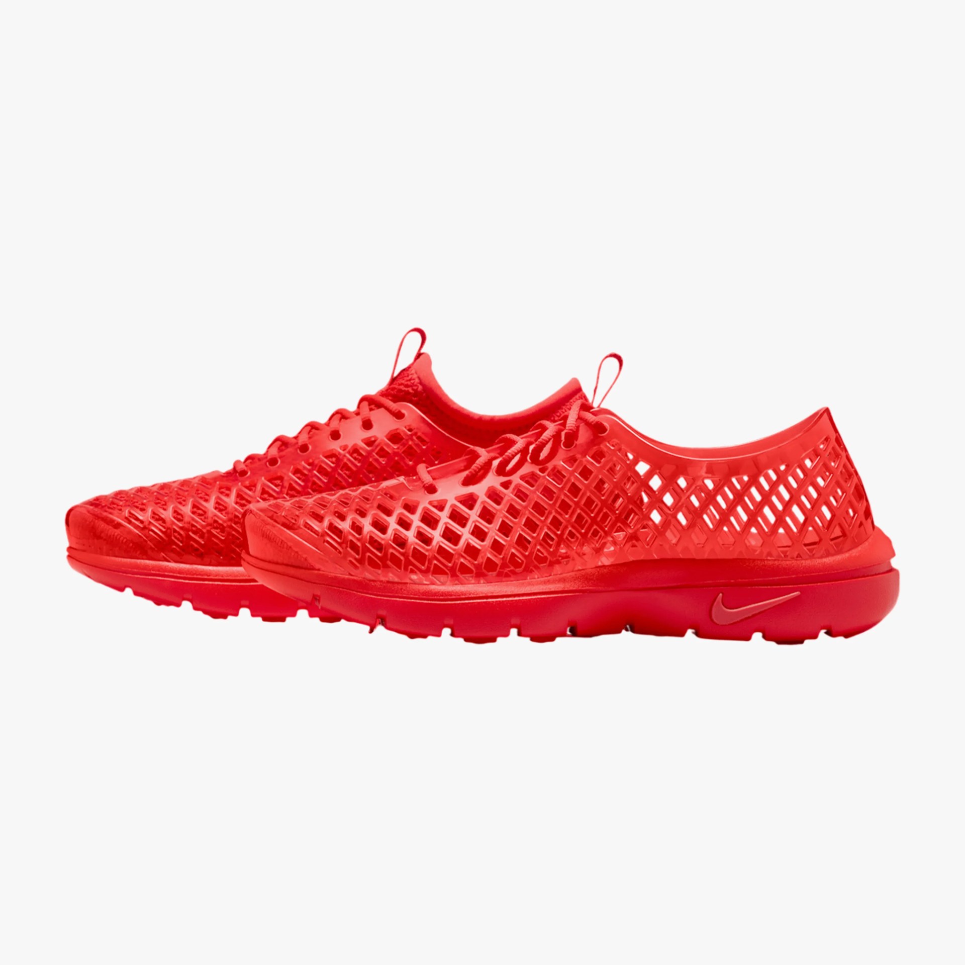 Pair of bright red Nike sneakers with a lattice design and pull tabs on a white background.