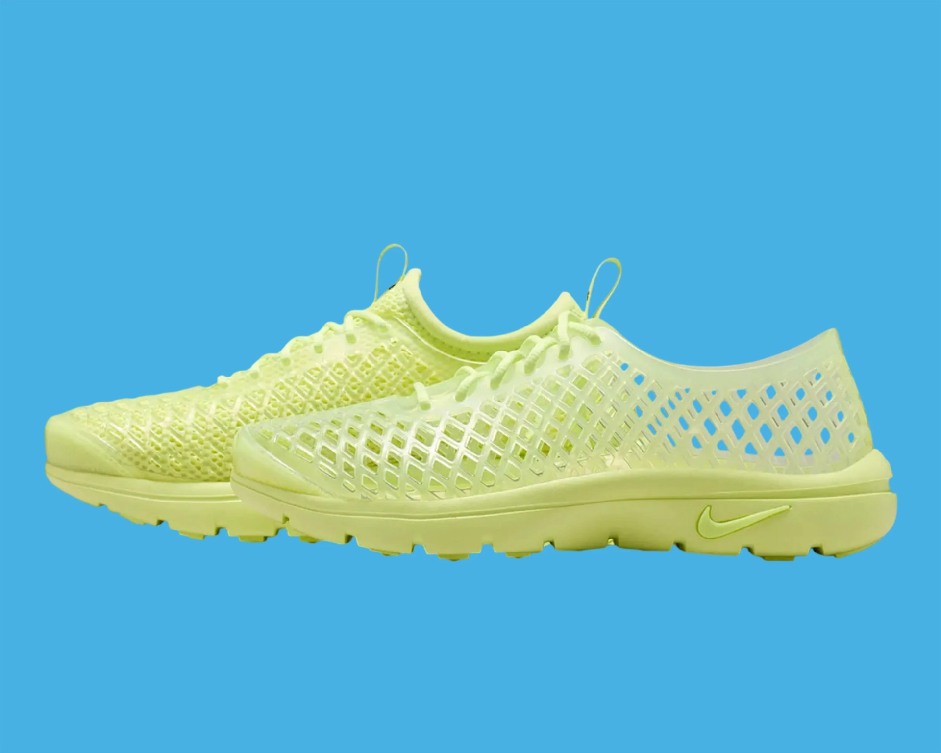 Pair of neon yellow Nike shoes with one featuring a mesh upper and the other a lattice design on a blue background.