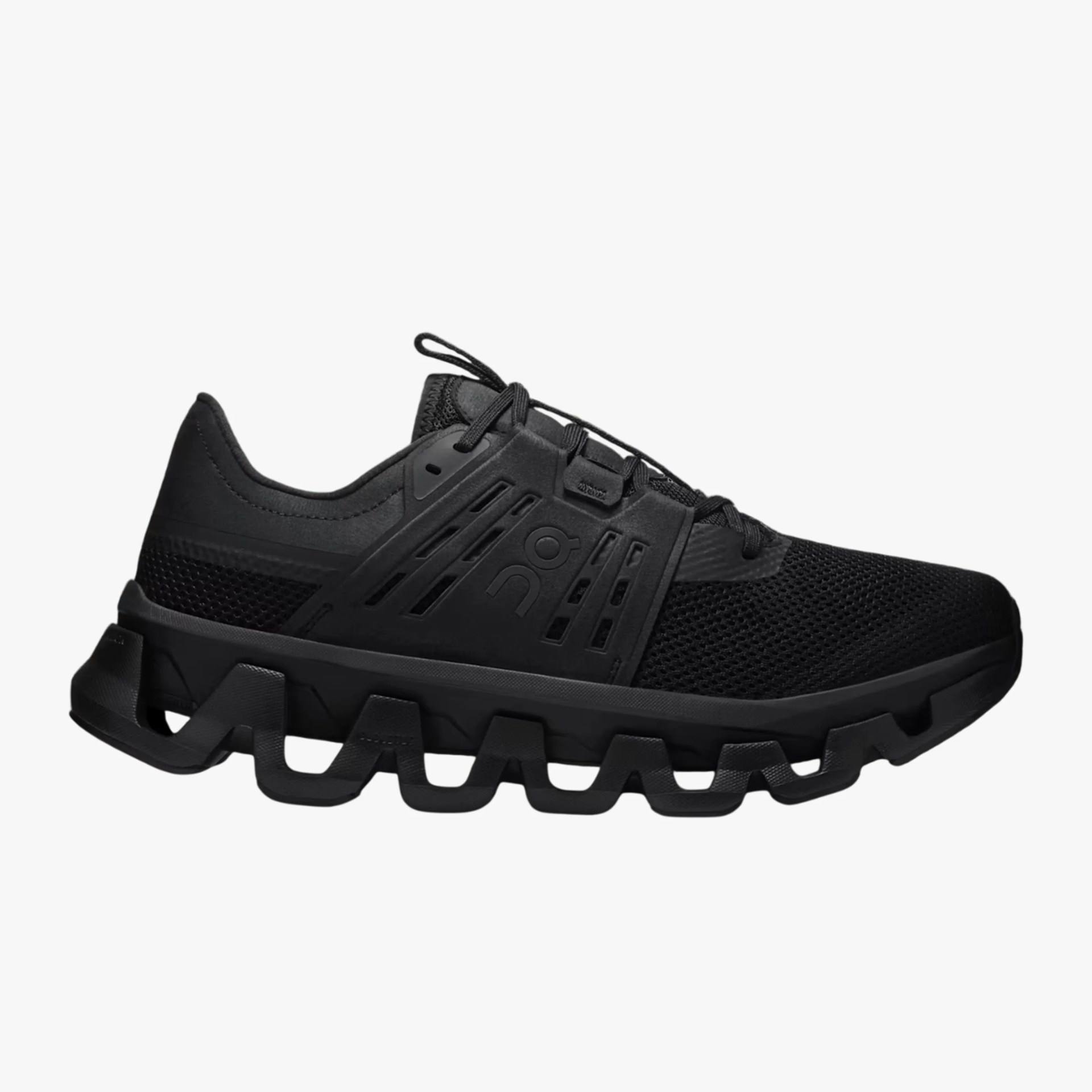 Black athletic shoe with mesh upper and unique segmented sole design.