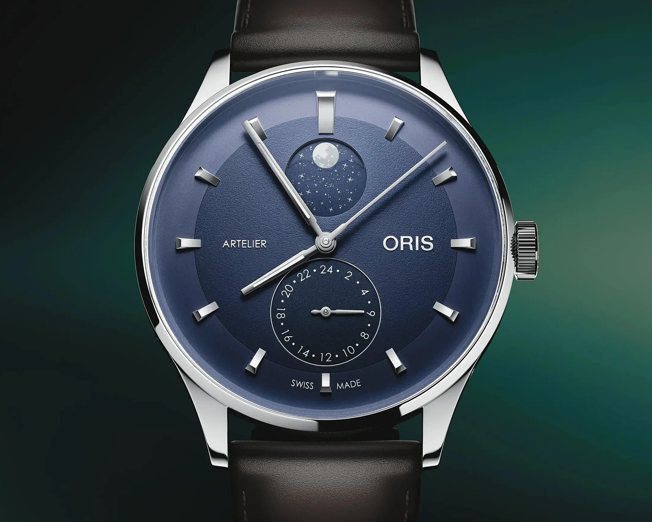 Blue Oris Artelier watch with moon phase and 24-hour subdial on black leather strap.