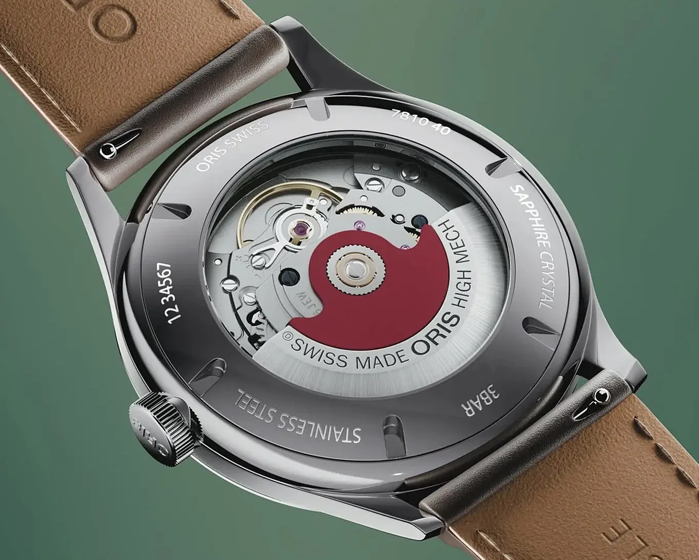 Close-up of the back of a stainless steel Oris Swiss watch with visible mechanical movement and brown leather strap.