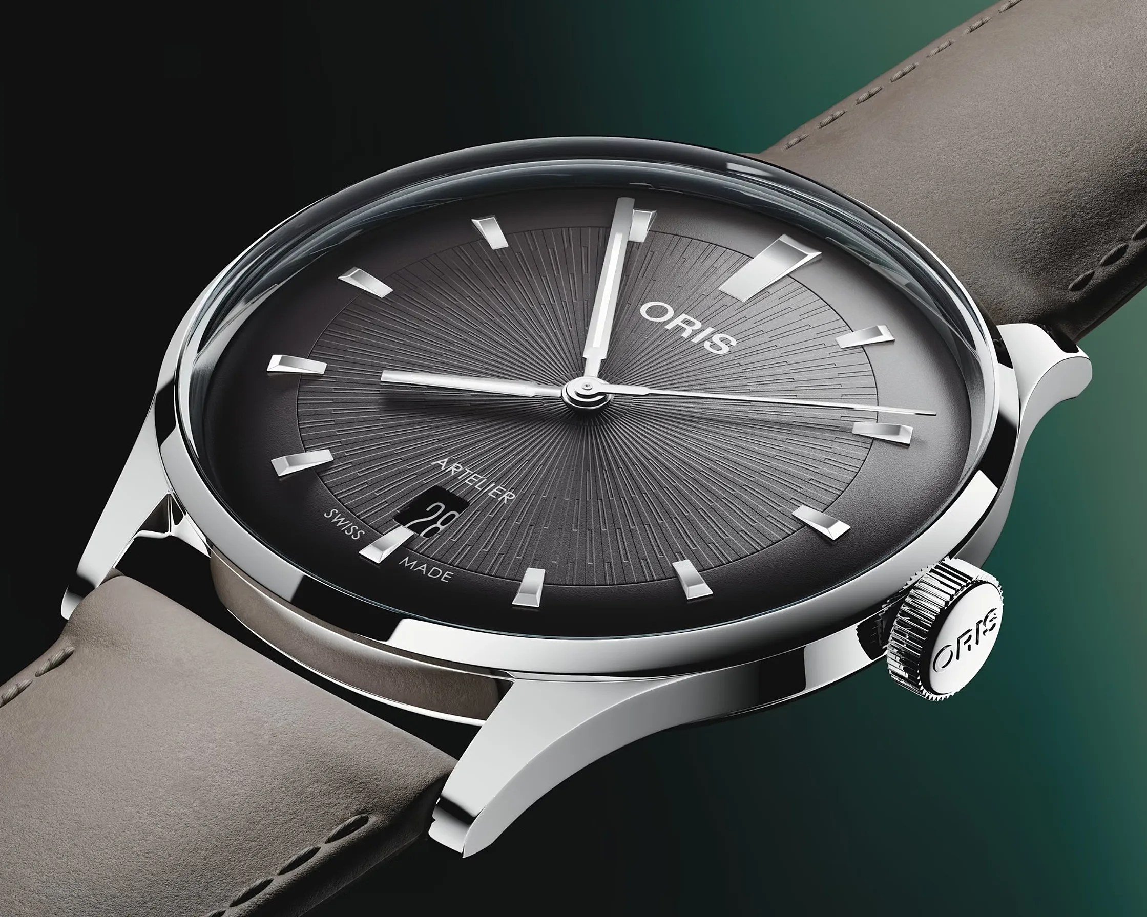 Close-up of an Oris Artelier watch with a textured black dial, silver markers, date window, and beige leather strap.