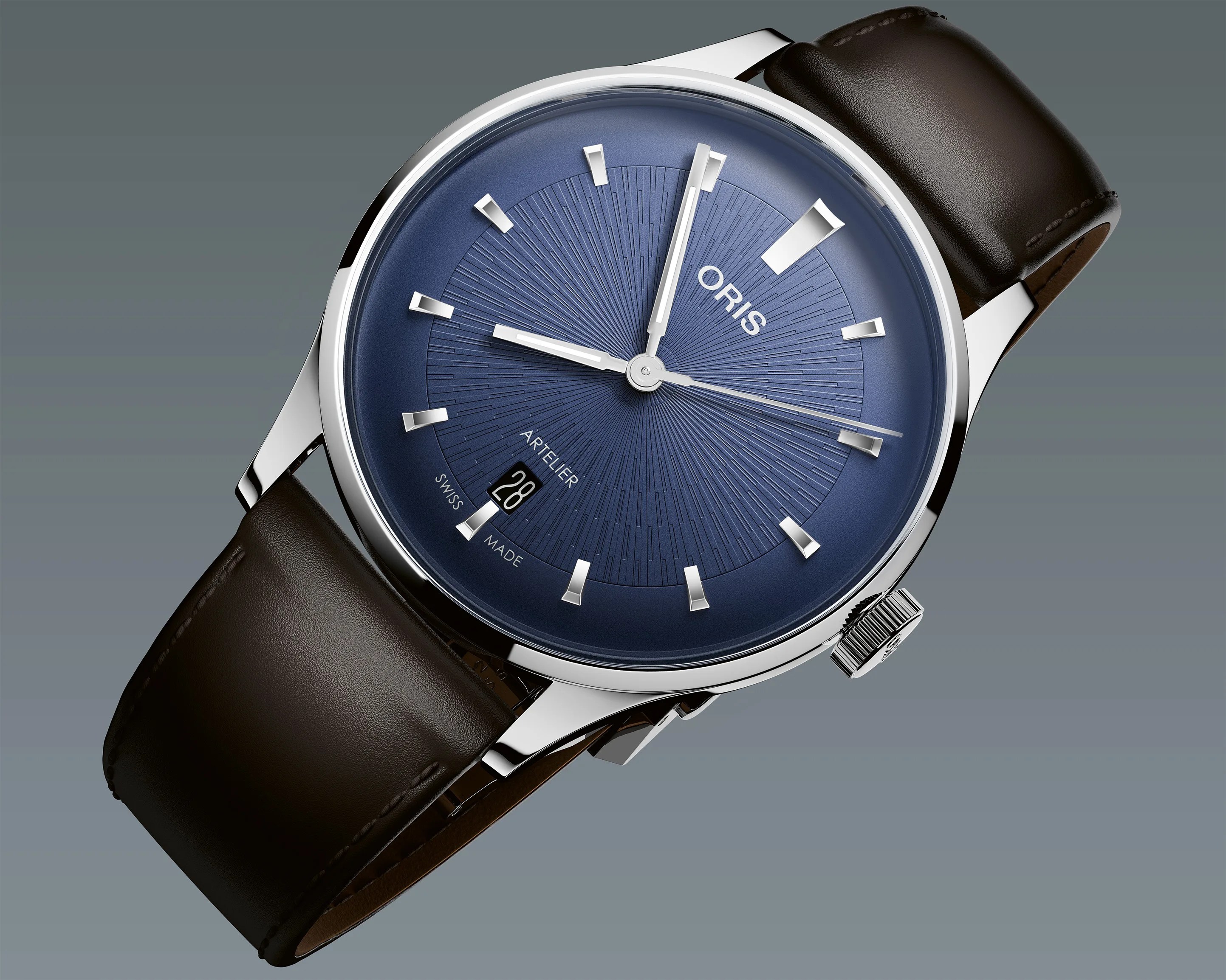 Silver Oris wristwatch with a textured blue dial, silver hour markers, and a dark brown leather strap.