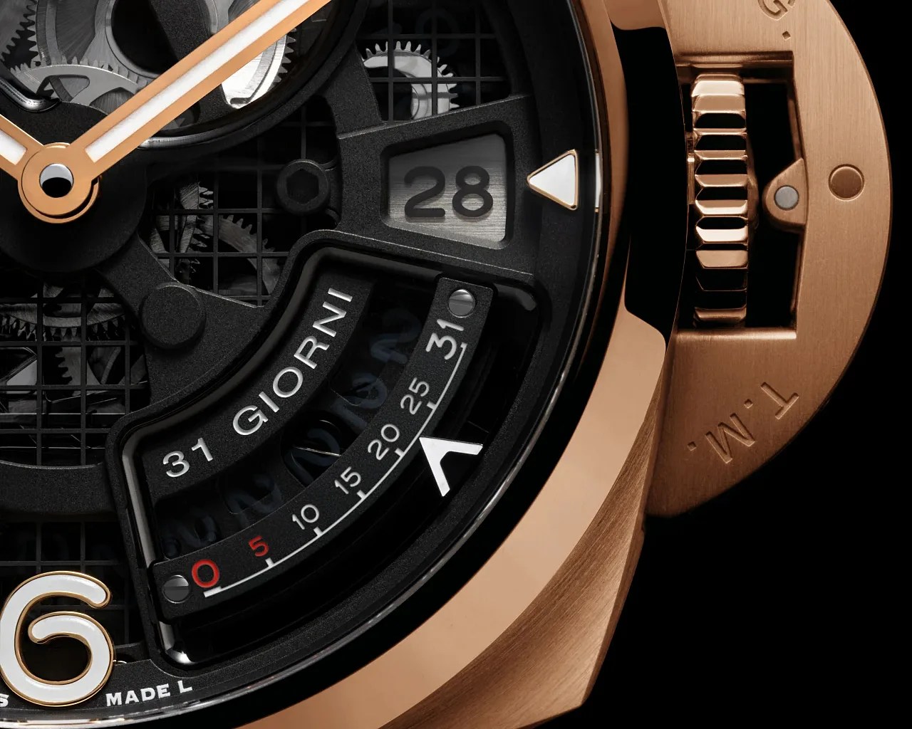 Close-up of a luxury watch face showing a rose gold case, black dial with visible gears, date window, and "31 GIORNI" power reserve indicator.