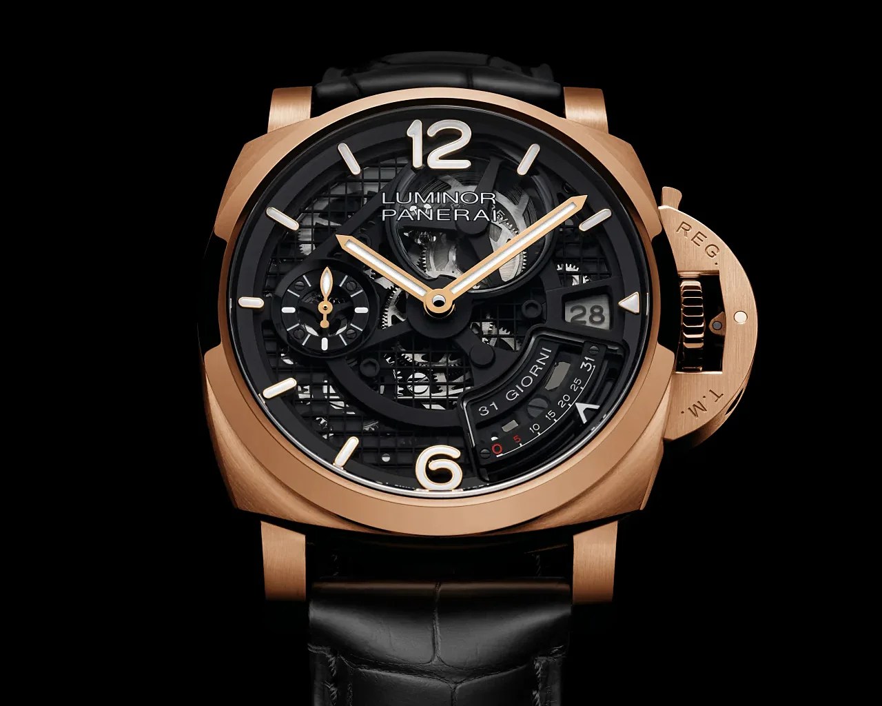 Rose gold Panerai Luminor wristwatch with black skeleton dial, date display, and black leather strap.