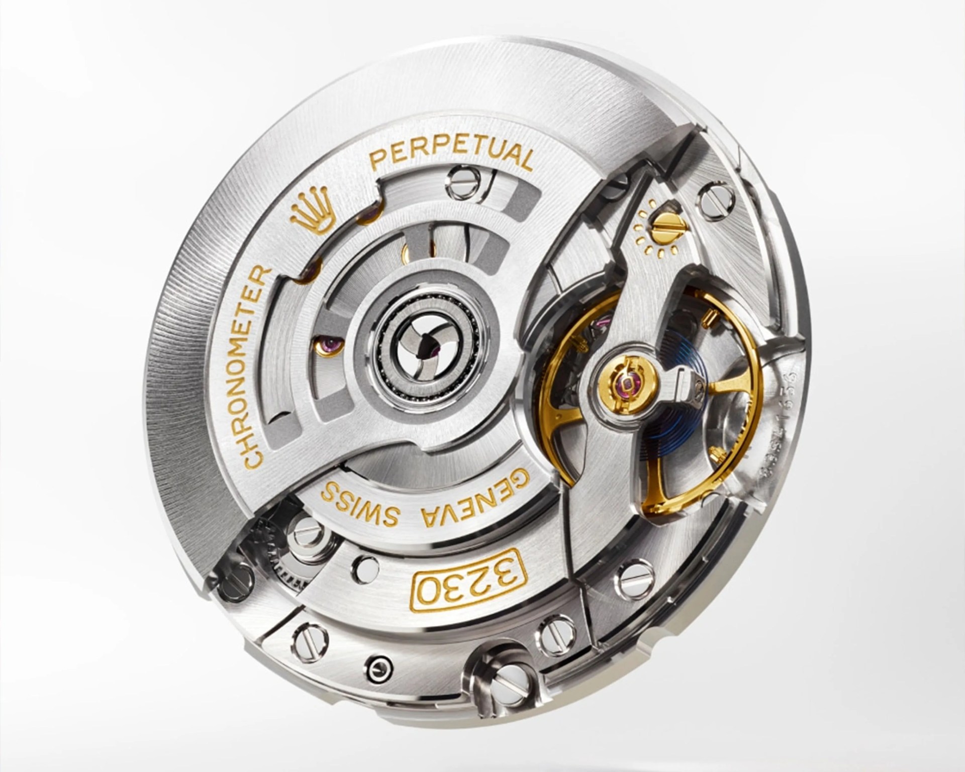 Close-up of a silver and gold Rolex watch movement mechanism with "CHRONOMETER PERPETUAL GENEVA SWISS 3230" engraved.