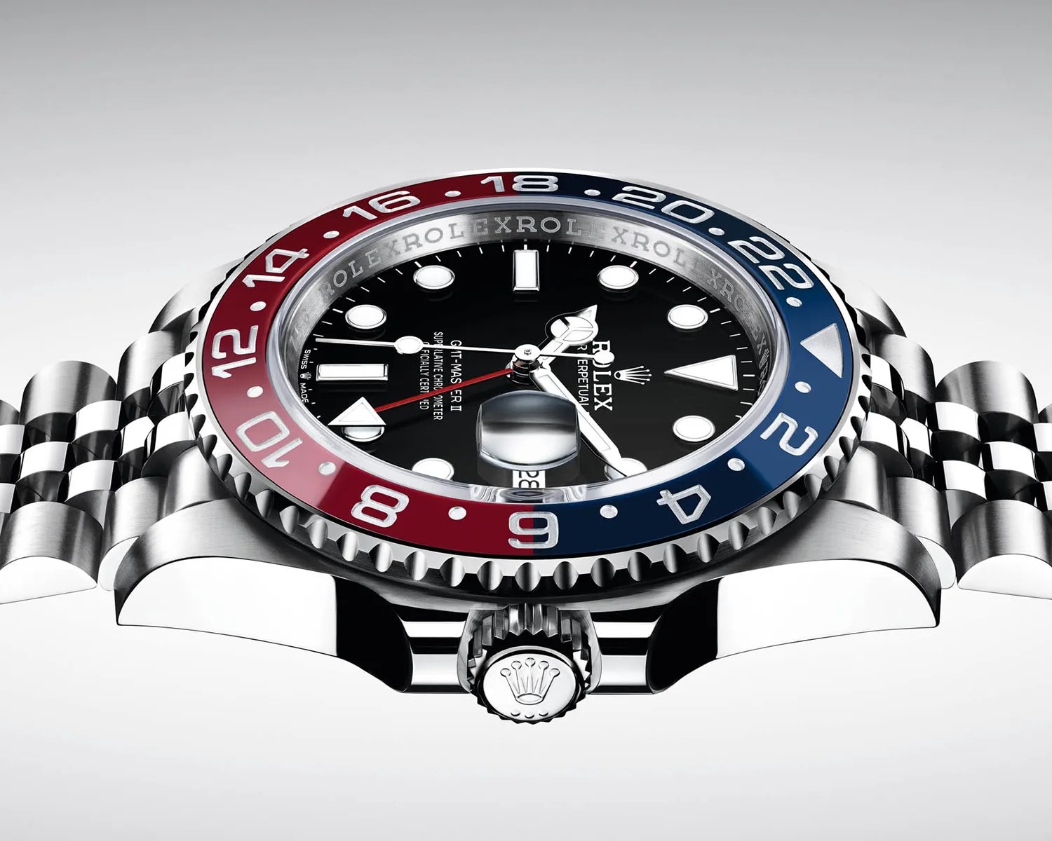 Rolex GMT-Master II watch with black dial, red and blue bezel, and stainless steel Jubilee bracelet.